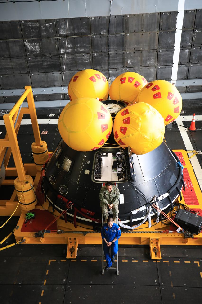 Members of NASA’s Exploration Ground System’s Landing and Recovery team aboard the USS San Diego pose in front of a mockup of the Orion spacecraft during Underway Recovery Test 11 (URT-11) off the coast of San Diego, California on Monday, Feb. 26, 2024. URT-11 is the eleventh in a series of Artemis recovery tests, and the first time NASA and its partners put their Artemis II recovery procedures to the test with the astronauts. 