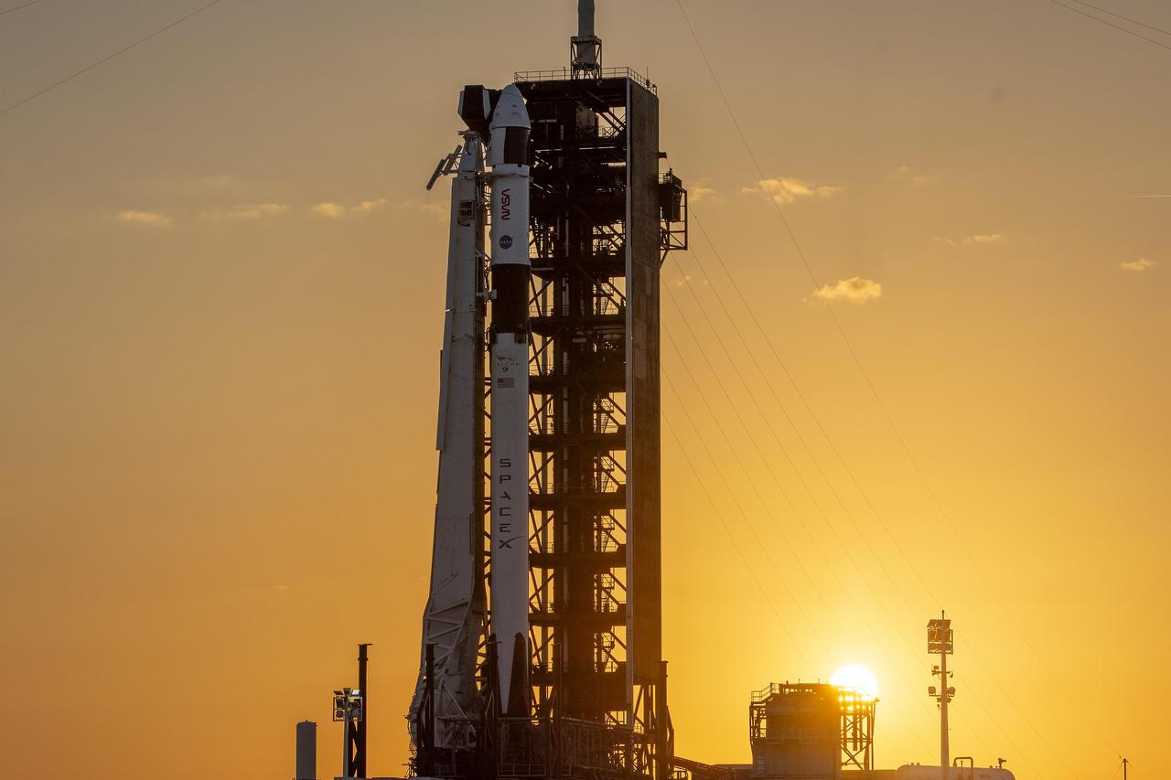 A colorful sunset serves as the backdrop for SpaceX’s Falcon 9 rocket and Dragon spacecraft on the pad at Launch Complex 39A at Kennedy Space Center in Florida on Monday, Feb. 26, 2024, ahead of NASA’s SpaceX Crew-8 mission. The crew members of NASA’s SpaceX Crew-8 mission, NASA astronauts Matthew Dominick, Michael Barratt, and Jeanette Epps, and Roscosmos cosmonaut Alexander Grebenkin, are slated to launch to the International Space Station no earlier than 12:04 a.m. EST on Friday, March 1, from Launch Complex 39A.
