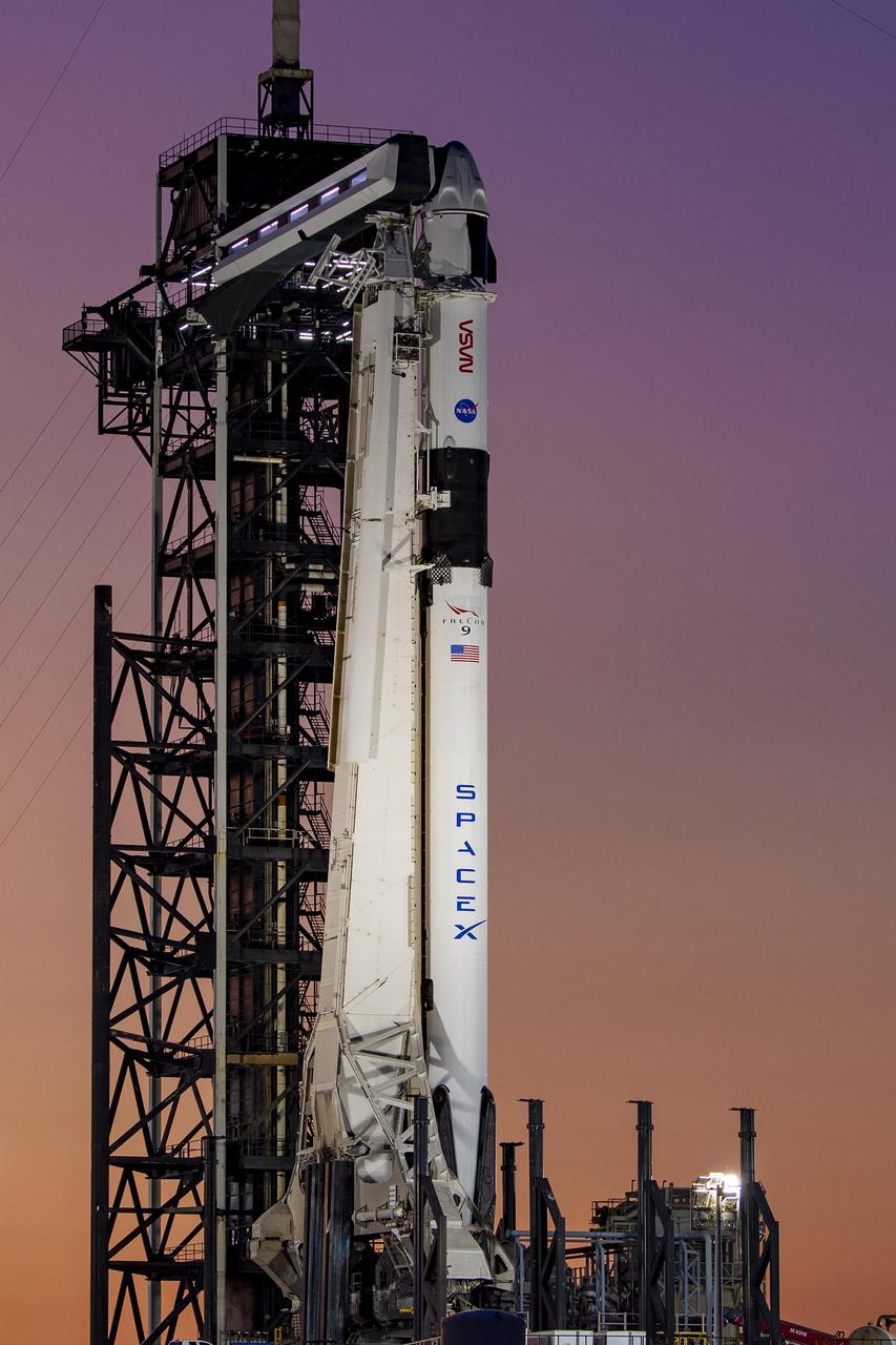A colorful sunset serves as the backdrop for SpaceX’s Falcon 9 rocket and Dragon spacecraft on the pad at Launch Complex 39A at Kennedy Space Center in Florida on Monday, Feb. 26, 2024, ahead of NASA’s SpaceX Crew-8 mission. The crew members of NASA’s SpaceX Crew-8 mission, NASA astronauts Matthew Dominick, Michael Barratt, and Jeanette Epps, and Roscosmos cosmonaut Alexander Grebenkin, are slated to launch to the International Space Station no earlier than 12:04 a.m. EST on Friday, March 1, from Launch Complex 39A.