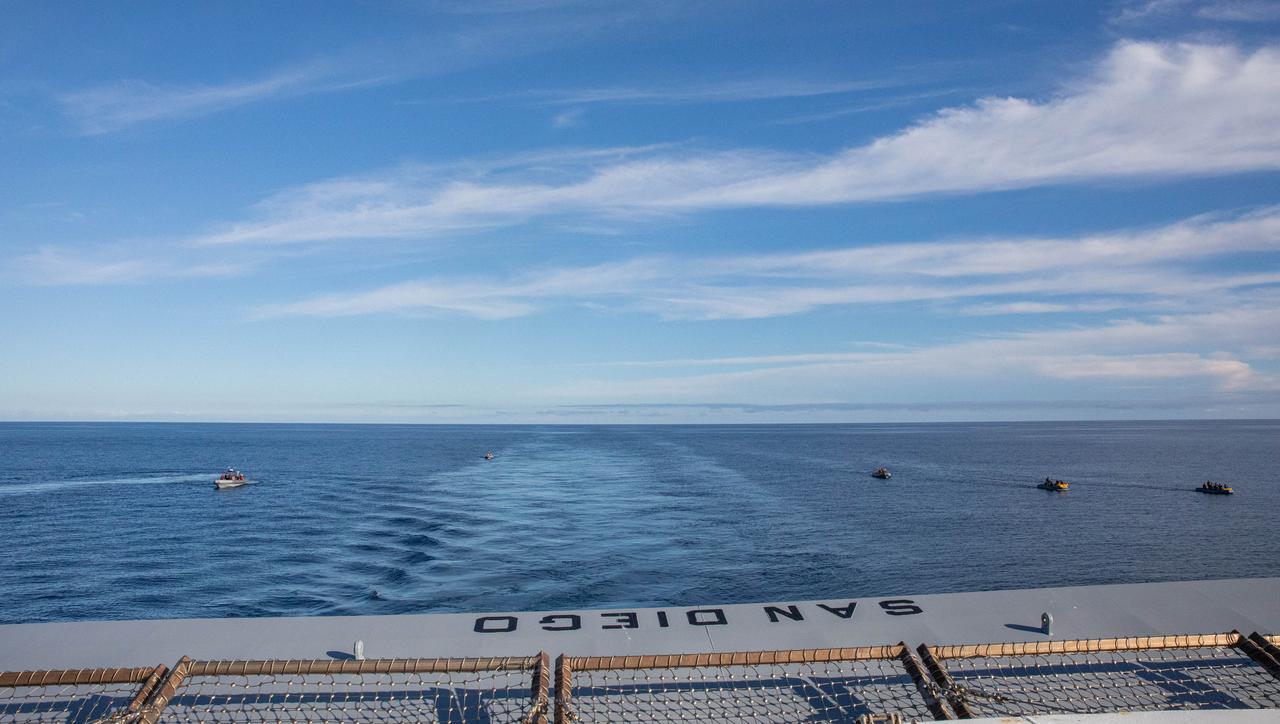 NASA’s Exploration Ground System’s Landing and Recovery team, partners from the Department of Defense, and U.S. Navy personnel practice recovery procedures in boats during Underway Recovery Test 11 (URT-11) off the coast of San Diego on Tuesday, Feb. 27, 2024. URT-11 is the eleventh in a series of Artemis recovery tests, and the first time NASA and its partners put their Artemis II recovery procedures to the test with the astronauts.