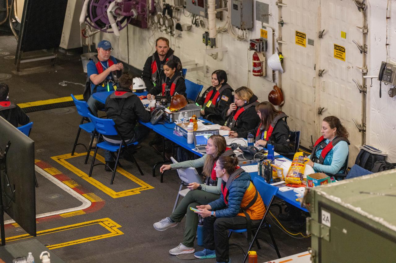 Members of NASA’s Exploration Ground System’s Landing and Recovery team and partners from the Department of Defense aboard the USS San Diego take a break following practice recovery procedures during Underway Recovery Test 11 (URT-11) off the coast of San Diego on Tuesday, Feb. 27, 2024. URT-11 is the eleventh in a series of Artemis recovery tests, and the first time NASA and its partners put their Artemis II recovery procedures to the test with the astronauts.
