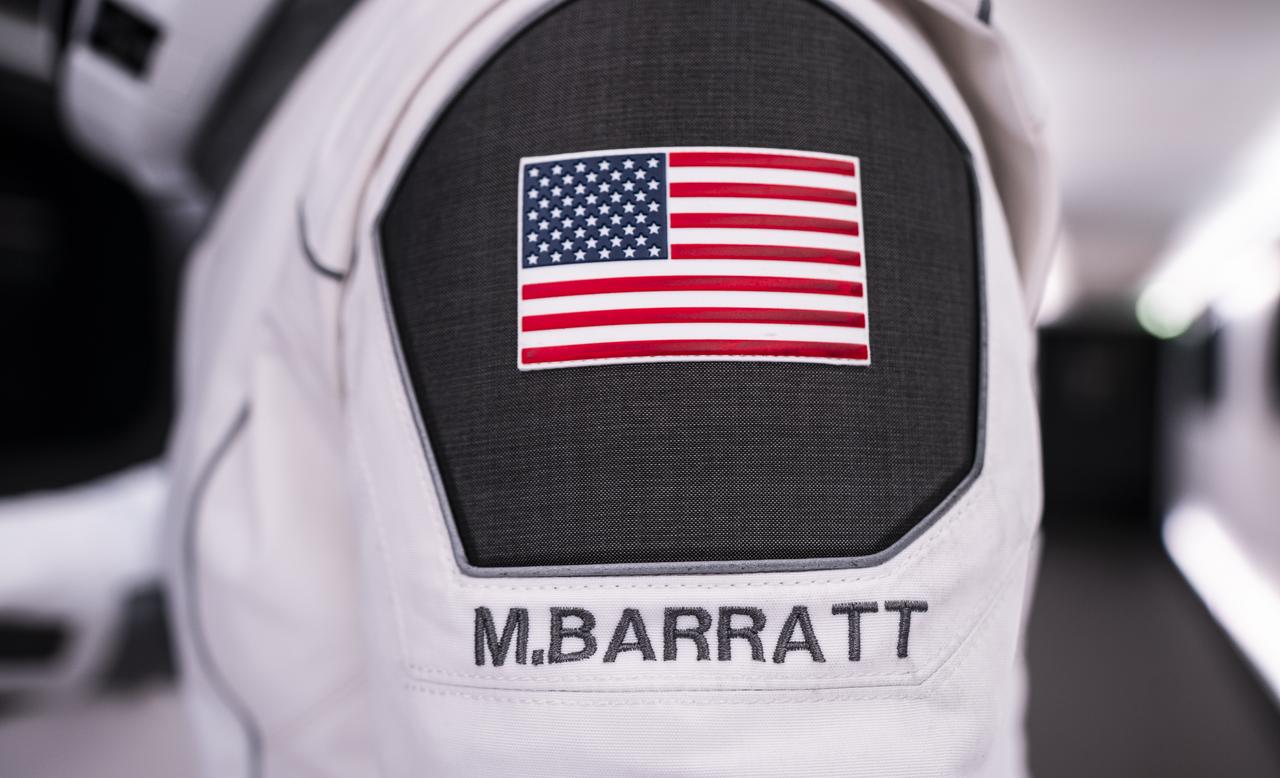 A SpaceX launch and entry suit bears an American flag and the name of NASA astronaut Michael Barratt, who will serve as pilot of NASA's SpaceX Crew-8 mission to the International Space as part of the agency’s Commercial Crew Program. Liftoff from Launch Complex 39A at the agency’s Kennedy Space in Florida is scheduled for 12:04 a.m. EST on Friday, March 1, 2024.