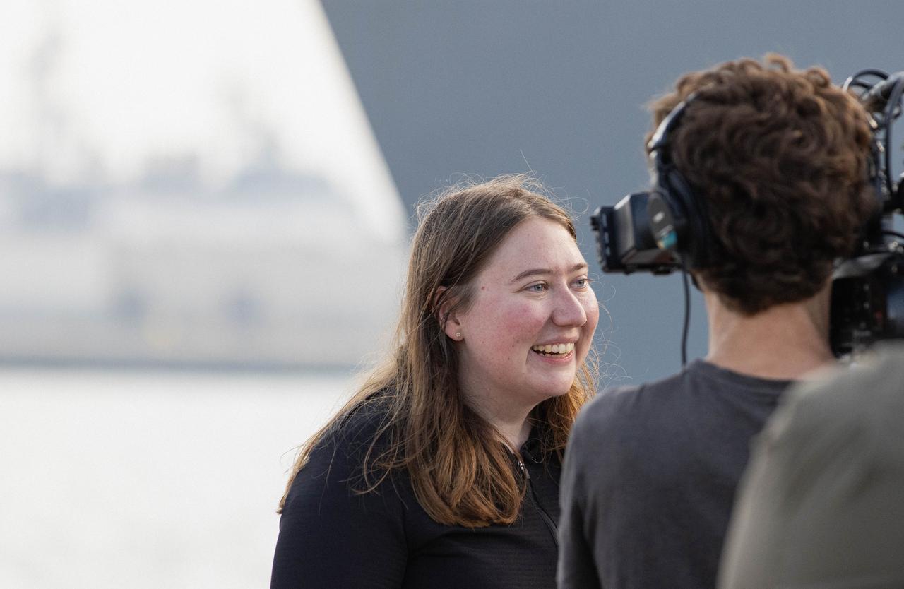 NASA’s Artemis program public affairs specialist Madison Tuttle speaks during a news conference about the practice recovery procedures performed by NASA’s Exploration Ground System’s Landing and Recovery team, partners from the Department of Defense, and U.S. Navy personnel during Underway Recovery Test  11 (URT-11) aboard the USS San Diego on Wednesday, Feb. 28, 2024. URT-11 performed by NASA’s Exploration Ground System’s Landing and Recovery team, partners from the Department of Defense, and U.S. Navy personnel aboard the USS San Diego is the eleventh in a series of Artemis recovery tests, and the first the Artemis II recovery procedures involved the astronauts.