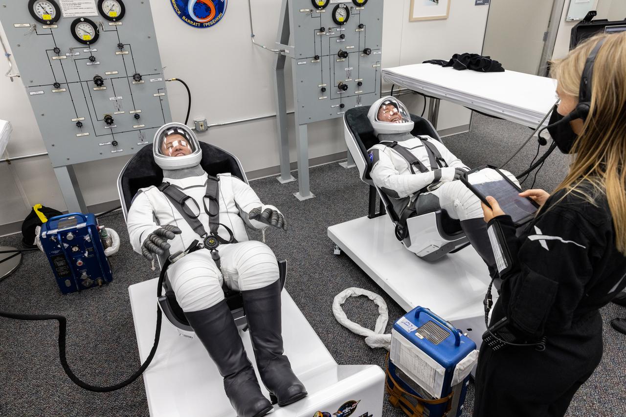 NASA’s SpaceX Crew-8 crew members and NASA astronauts from left to right, Matthew Dominick and Michael Barratt check their SpaceX spacesuit in the crew suit-up room inside the Neil A. Armstrong Operations and Checkout Building at NASA’s Kennedy Space Center in Florida on Saturday, March 2, 2024. The Crew-8 crew members are preparing for their launch to the International Space Station aboard SpaceX’s Dragon spacecraft atop the Falcon 9 rocket from Launch Complex 39A 10:53 p.m. EST on Sunday, March 3, 2024.