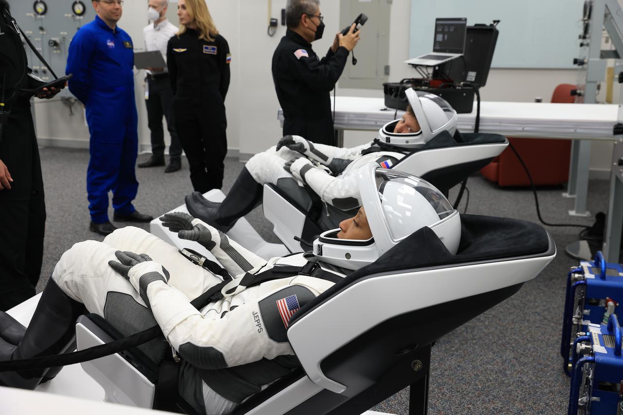 NASA’s SpaceX Crew-8 crew member from left to right Jeanette Epps and Roscosmos cosmonaut Alexander Grebenkin relaxes in the suit-up room in the Astronaut Crew Quarters inside Kennedy Space Center’s Neil A. Armstrong Operations and Checkout Building a few hours before launch on Sunday, March 3, 2024. During suit-up, a team of SpaceX suit technicians assist the crew as they put on their custom-fitted spacesuits and perform leak checks. As part of NASA’s Commercial Crew Program, the Crew-8 crew members are scheduled to launch aboard SpaceX’s Dragon spacecraft and Falcon 9 rocket to the International Space Station 10:53 p.m. EST Sunday, March 3, 2024, from Kennedy’s Launch Complex 39A.