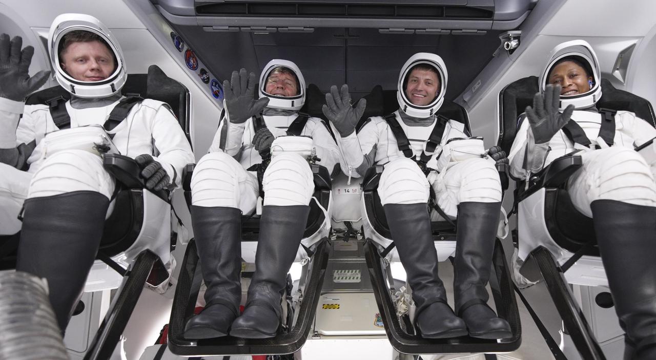NASA’s SpaceX Crew-8 astronauts from right to left NASA astronauts Jeanette Epps, Matthew Dominick, and Michael Barratt, and Roscosmos cosmonaut Alexander Grebenkin smile and wave inside a Dragon spacecraft at Launch Complex 39A at Kennedy Space Center in Florida ahead of liftoff scheduled for 10:53 p.m. on Sunday, March 3, 2024. The Crew-8 mission is the eighth crew rotation mission with SpaceX to the station, and the ninth flight of Dragon with people as part of the agency’s Commercial Crew Program.