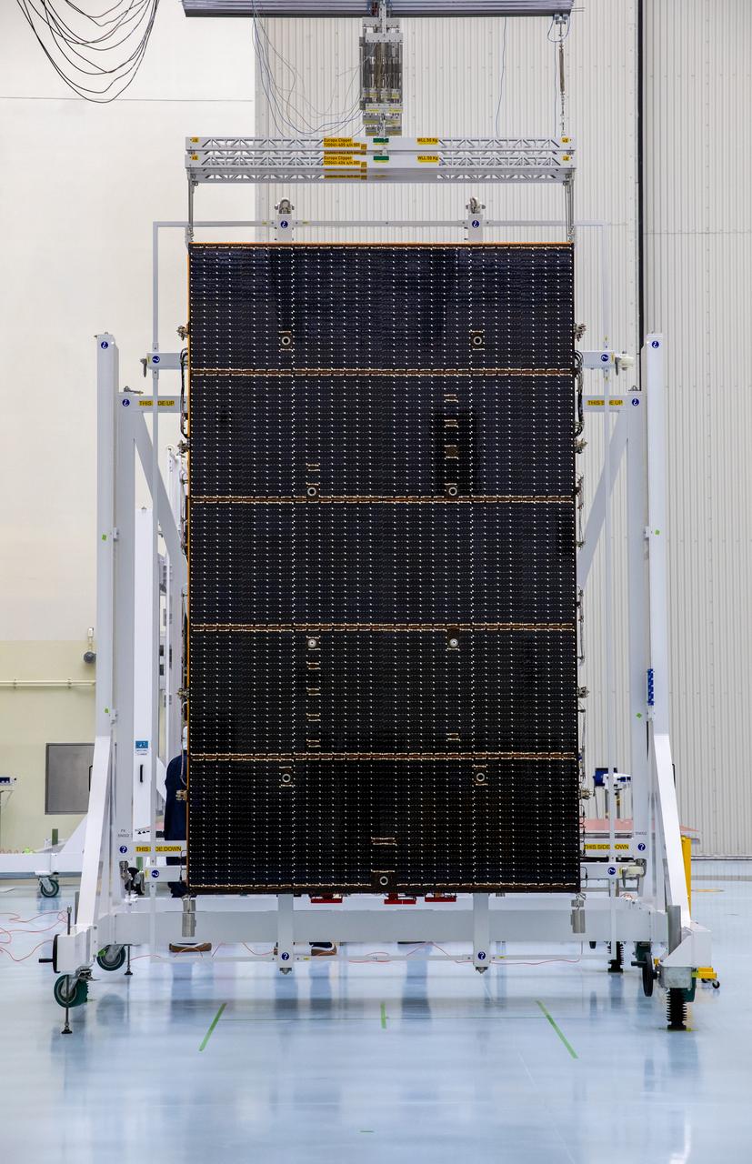 The first of two five-panel solar arrays built for NASA’s Europa Clipper stands inside the Payload Hazardous Servicing Facility at the agency’s Kennedy Space Center in Florida in preparation for inspection and cleaning as part of assembly, test, and launch operations on Wednesday, March 6, 2024. When both solar arrays are installed and deployed on Europa Clipper – the agency’s largest spacecraft ever developed for a planetary mission – the spacecraft will span a total length of more than 100 feet and weigh 7,145 pounds without the inclusion of propellants. 