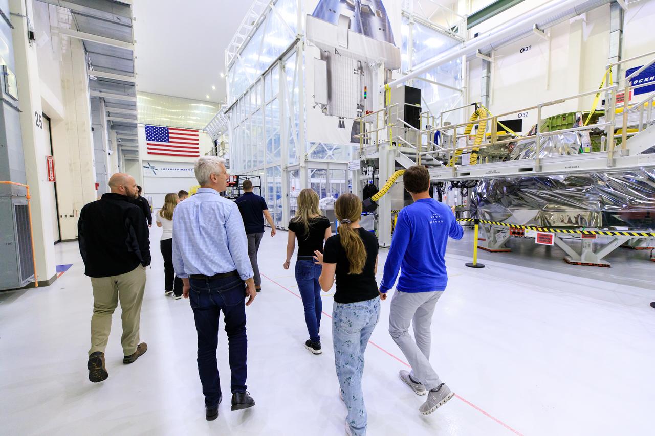 Artemis II crew members and their families visit the Neil A. Armstrong Operations and Checkout Building at NASA’s Kennedy Space Center in Florida, on Friday, March 15, 2024. Artemis II Commander Reid Wiseman and Artemis II Mission Specialist Jeremy Hansen toured the facility with their families and viewed the Orion spacecraft for Artemis III.