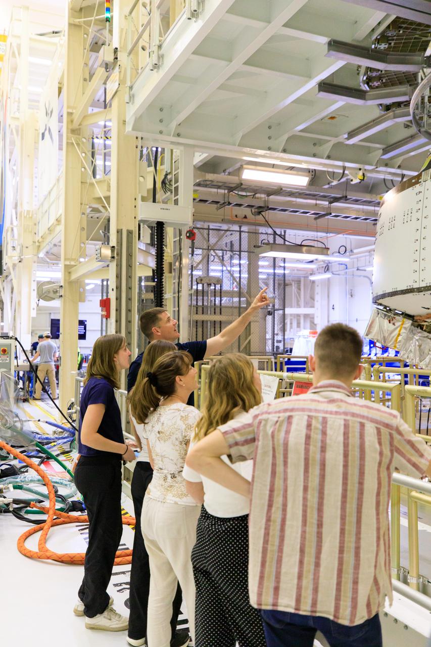 Artemis II Mission Specialist Jeremy Hansen and his family view the Orion spacecraft for Artemis II during a tour of the Neil A. Armstrong Operations and Checkout Building at NASA’s Kennedy Space Center in Florida, on Friday, March 15, 2024. Along with Artemis II Commander Reid Wiseman, Hansen toured the facility with family members and viewed the Orion crew modules, including the spacecraft that will take them, along with Artemis II Pilot Victor Glover and Artemis II Mission Specialist Christina Hammock Koch, around the Moon and back during the Artemis II mission.