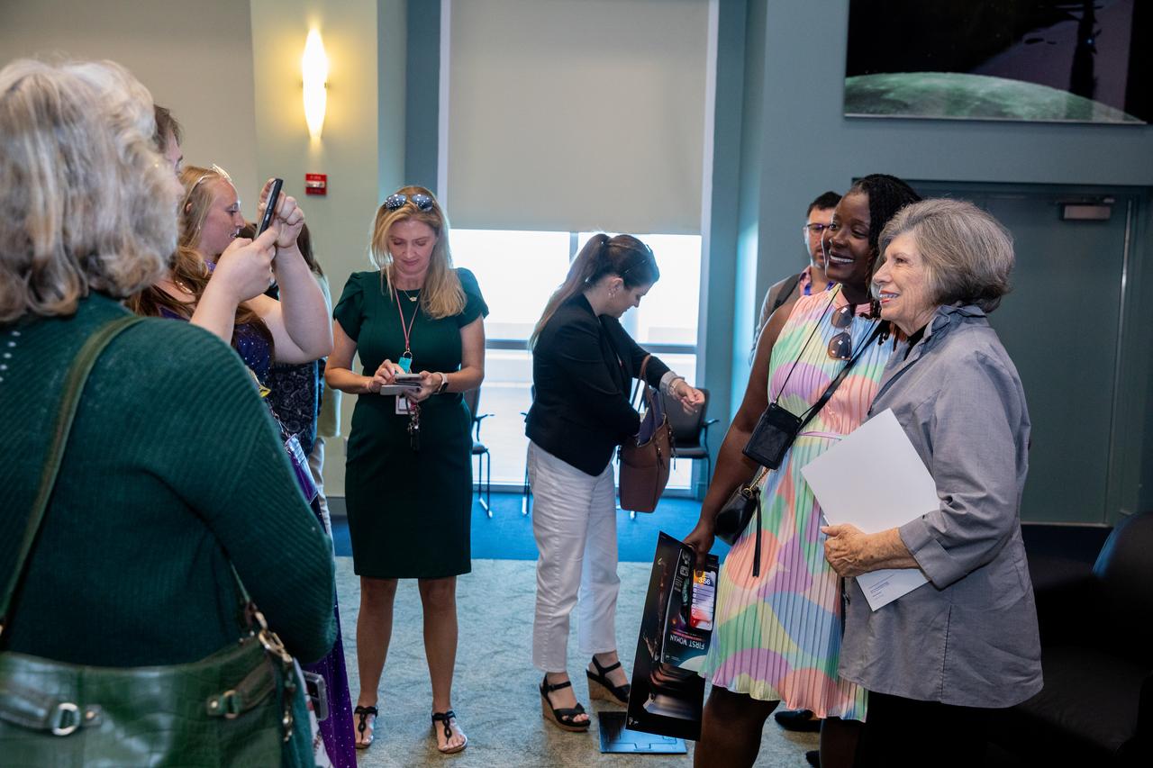 JoAnn Morgan, former associate director of NASA Kennedy Space Center, poses for photos with attendees of a panel discussion honoring Women's History Month held on Friday, March 15, 2024, inside the Operations Support Building II at the agency’s Kennedy Space Center in Florida. The Women Launching Women panel commemorates inspirational women and men who have lifted and helped others excel in their careers across the agency and offer words of advice for the current workforce.