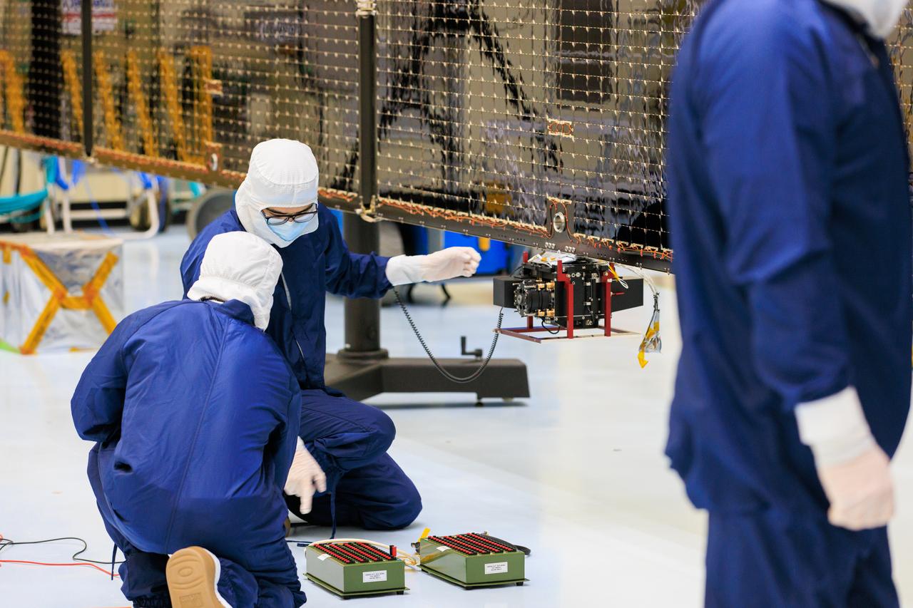 Technicians inside the Payload Hazardous Servicing Facility at NASA’s Kennedy Space Center in Florida install and test antennas on a solar array on Wednesday, March 20, 2024, for the agency’s Europa Clipper spacecraft which will study Jupiter’s icy moon Europa to determine if the planet has conditions that could support life. The REASON, (Radar for Europa Assessment and Sounding: Ocean to Near-surface) instrument will use the antennas to send both High Frequency (HF) and Very High Frequency (VHF) radio waves to penetrate up to 18 miles (30 kilometers) deep and search the ocean, measure ice thickness, and study the topography, composition, and roughness of Europa’s surface. The Europa Clipper spacecraft will ship to Florida later this year from NASA’s Jet Propulsion Lab in Southern California in preparation for launch aboard a SpaceX Falcon Heavy rocket from Kennedy’s Launch Complex 39A targeting October.