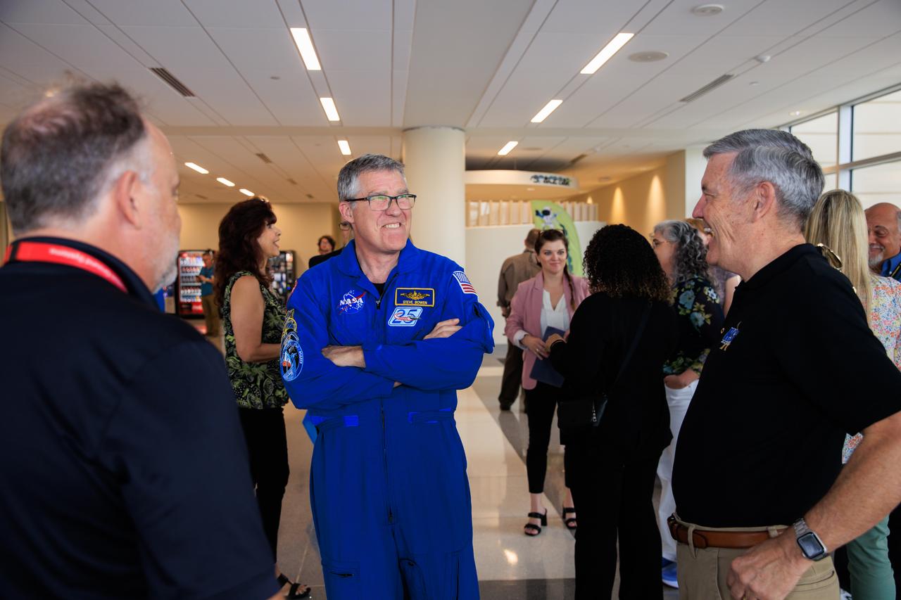 NASA’s SpaceX Crew-6 astronaut Stephen Bowen talks with former Kennedy Space Center director Bob Cabana and Exploration Ground Systems manager Shawn Quinn at the agency’s Central Campus Headquarters cafeteria at Kennedy Space Center in Florida on Wednesday, March 27, 2024. Employees met Crew-6 astronauts and celebrated Cabana who retired as the center director in December after serving in the position for 13 years. 