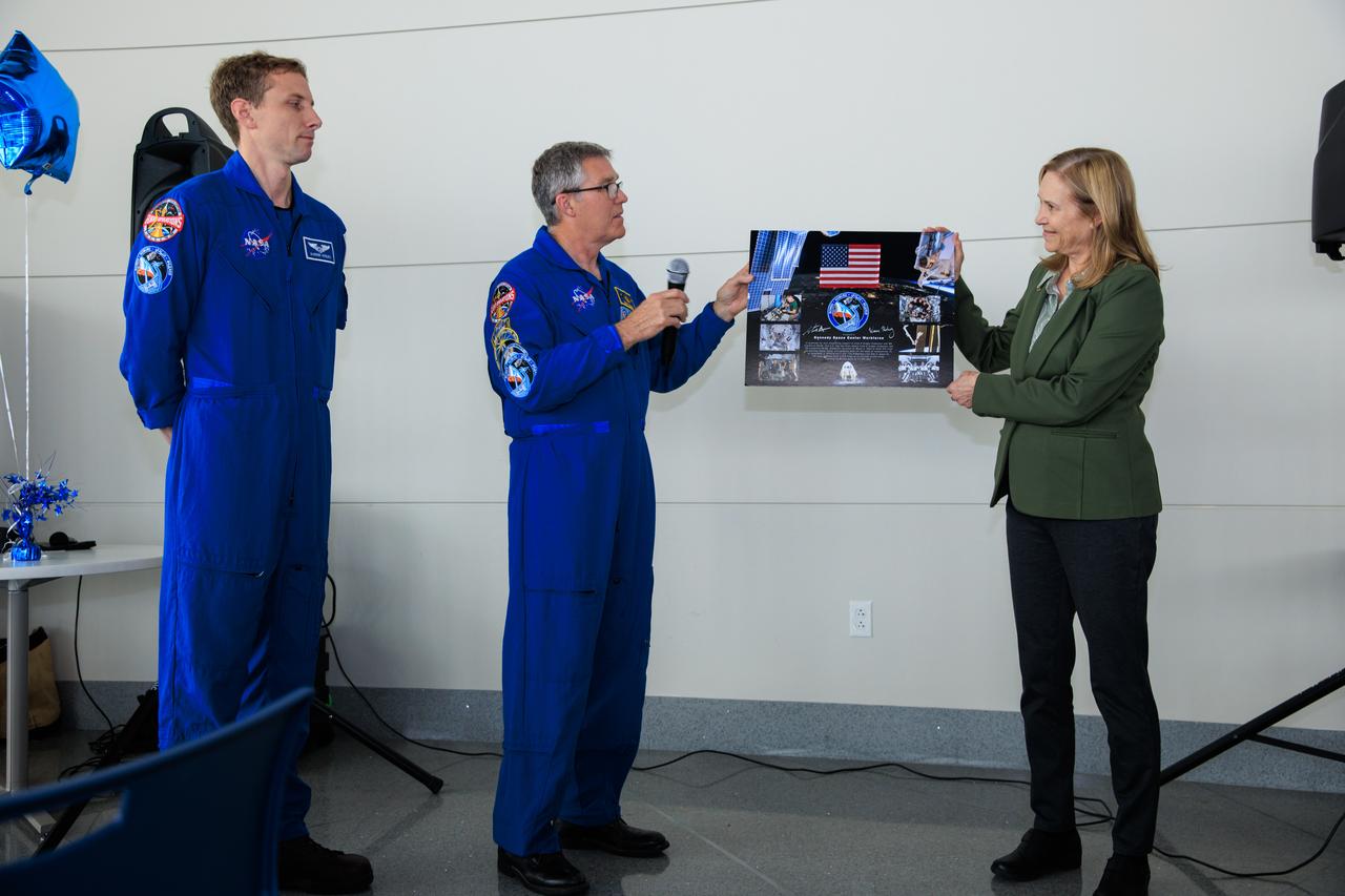 NASA’s SpaceX Crew-6 astronauts Warren “Woody” Hoburg and Stephen Bowen speak with Kennedy Space Center director Janet Petro during a meet-and-greet at the agency’s Central Campus Headquarters cafeteria at Kennedy Space Center in Florida on Wednesday, March 27, 2024. The astronauts present a plaque to Petro commemorating the agency’s sixth rotational crew mission to the to the International Space Station in partnership with SpaceX.