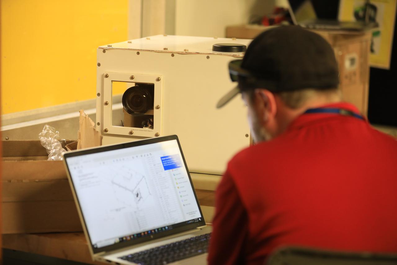 NASA researcher A.J. Jaffe prepares the NASA Airborne Instrumentation for Real-world Video of Urban Environments (AIRVUE) sensor pod for testing at NASA’s Kennedy Space Center in Cape Canaveral, Florida in April 2024. The AIRVUE pod will be used to collect data for autonomous aircraft like air taxis, drones, or other Advanced Air Mobility aircraft.
