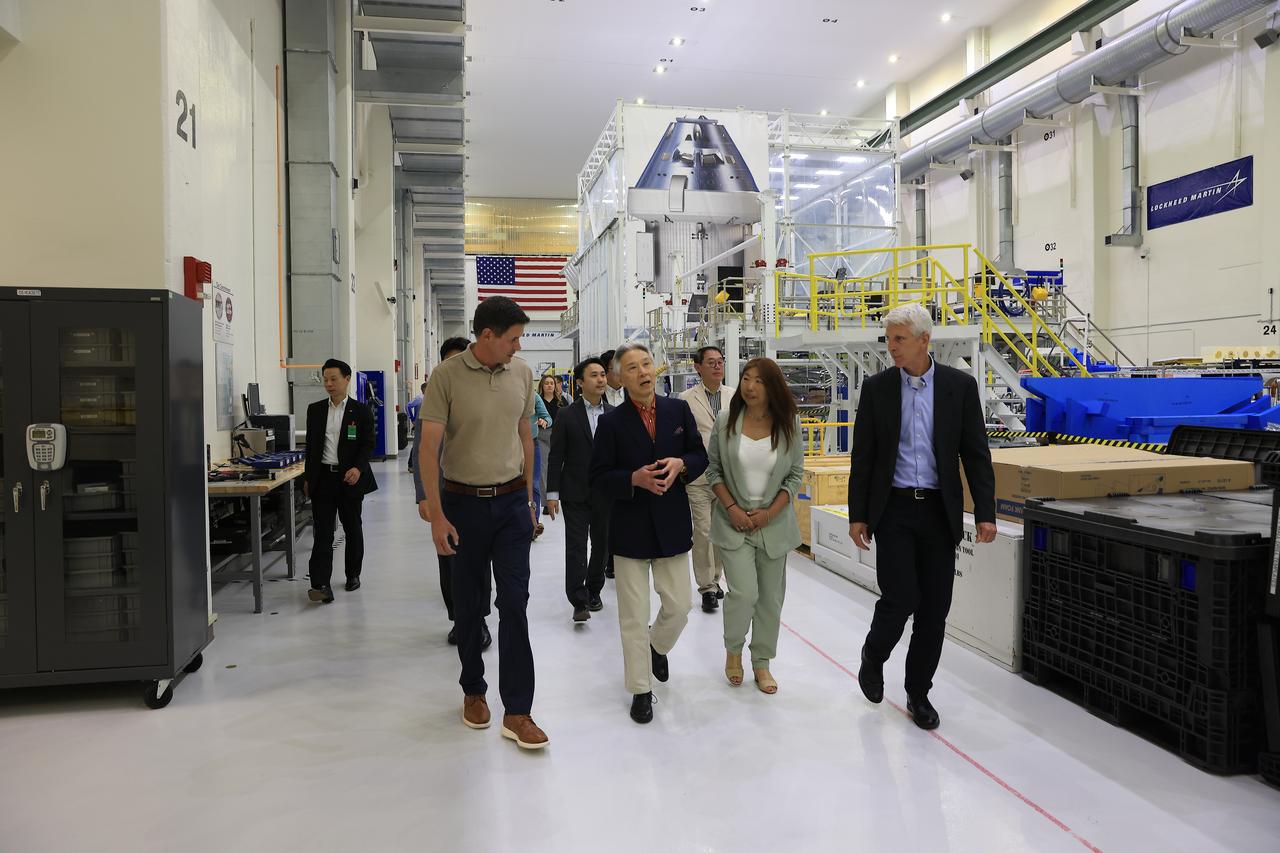 Nathan Varn, Program Director Orion Productions for Lockheed Martin, left, and Scott Wilson, NASA’s Division Chief, Orion Production Operations Office, right, lead a tour of the Neil A. Armstrong Operations and Checkout Building at NASA’s Kennedy Space Center in Florida, for Japanese Minister of Education, Culture, Sports, Science and Technology (MEXT) Masahito Moriyama on Friday, April 12, 2024. Moriyama’s visit included viewing the Orion crew modules for upcoming Artemis missions, which will land the first woman, first person of color, and NASA’s first international partner astronaut on the Moon.