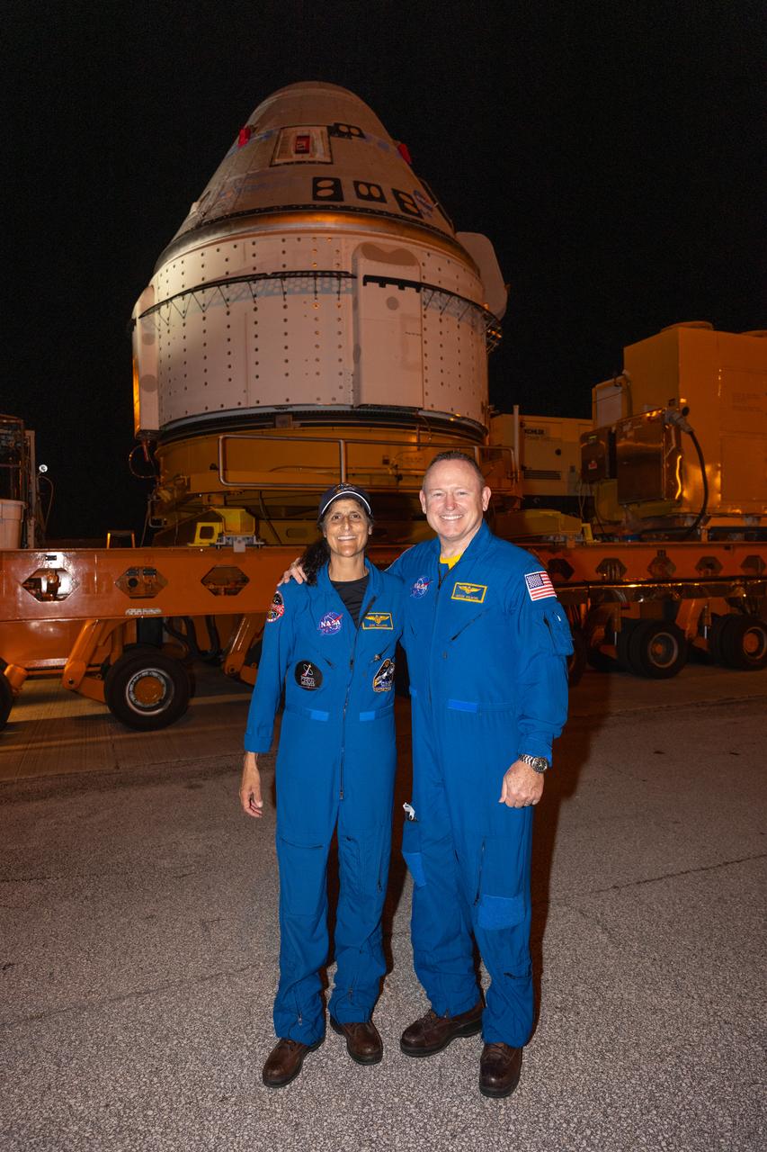From left to right, NASA astronauts Suni Williams and Butch Wilmore pose in front of Boeing’s Starliner spacecraft in the early morning of Tuesday, April 16, 2024, outside the company’s Commercial Crew and Cargo Processing Facility at the agency’s Kennedy Space Center in Florida. The spacecraft will take the astronauts to the International Space Station as part of the agency’s Boeing Crew Flight Test no earlier than Monday, May 6, 2024.