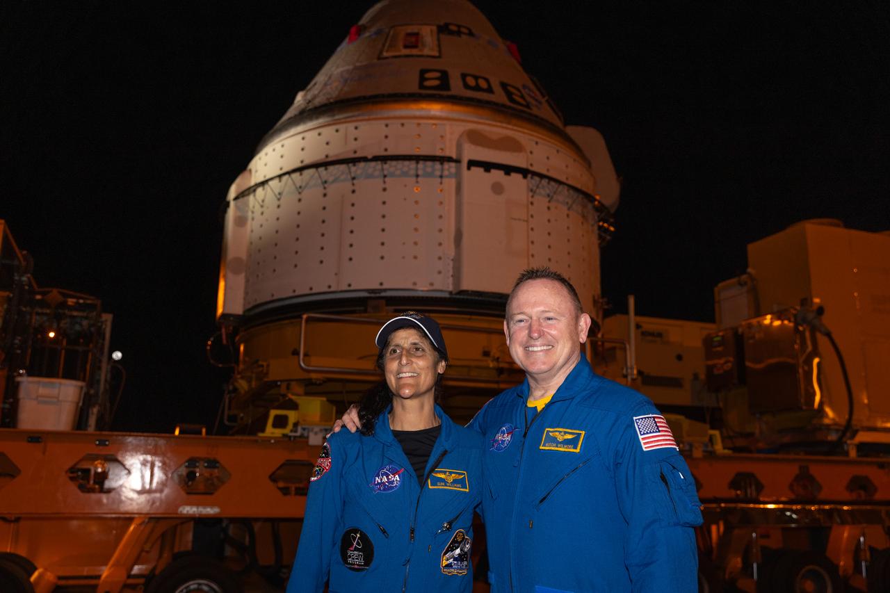 From left to right, NASA astronauts Suni Williams and Butch Wilmore pose in front of Boeing’s Starliner spacecraft in the early morning of Tuesday, April 16, 2024, outside the company’s Commercial Crew and Cargo Processing Facility at the agency’s Kennedy Space Center in Florida. The spacecraft will take the astronauts to the International Space Station as part of the agency’s Boeing Crew Flight Test no earlier than Monday, May 6, 2024.