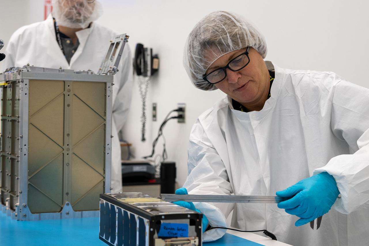 Technicians with the University of Kansas prepare their KUbeSat-1 for integration at Firefly’s Payload Processing Facility at Vandenberg Space Force Base, California on Thursday, April 25, 2024. KUbeSat-1, along with several other CubeSats, will launch to space on an Alpha rocket during NASA’s Educational Launch of Nanosatellites (ELaNa) 43 mission as part of the agency’s CubeSat Launch Initiative and Firefly’s Venture-Class Launch Services Demonstration 2 contract.