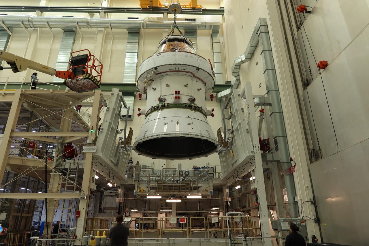 The Orion spacecraft crew module for NASA’s Artemis II mission is photographed being lowered inside the Final Assembly and System Testing cell by a 30 ton crane at the Neil Armstrong Operations and Checkout Building at NASA’s Kennedy Space Center in Florida on Saturday, April 27, 2024. Four astronauts will venture around the Moon in the Orion spacecraft on Artemis II, the first crewed mission on NASA's path to establishing a long-term presence at the Moon for science and exploration through the Artemis campaign.