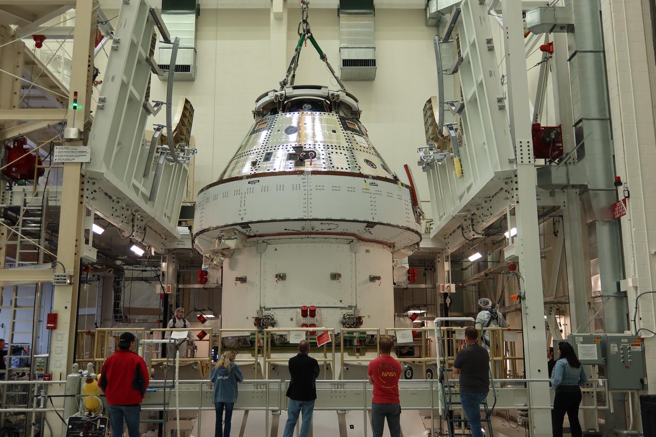 The Orion spacecraft crew module for NASA’s Artemis II mission is photographed being lowered inside the Final Assembly and System Testing cell by a 30 ton crane at the Neil Armstrong Operations and Checkout Building at NASA’s Kennedy Space Center in Florida on Saturday, April 27, 2024. Four astronauts will venture around the Moon in the Orion spacecraft on Artemis II, the first crewed mission on NASA's path to establishing a long-term presence at the Moon for science and exploration through the Artemis campaign.