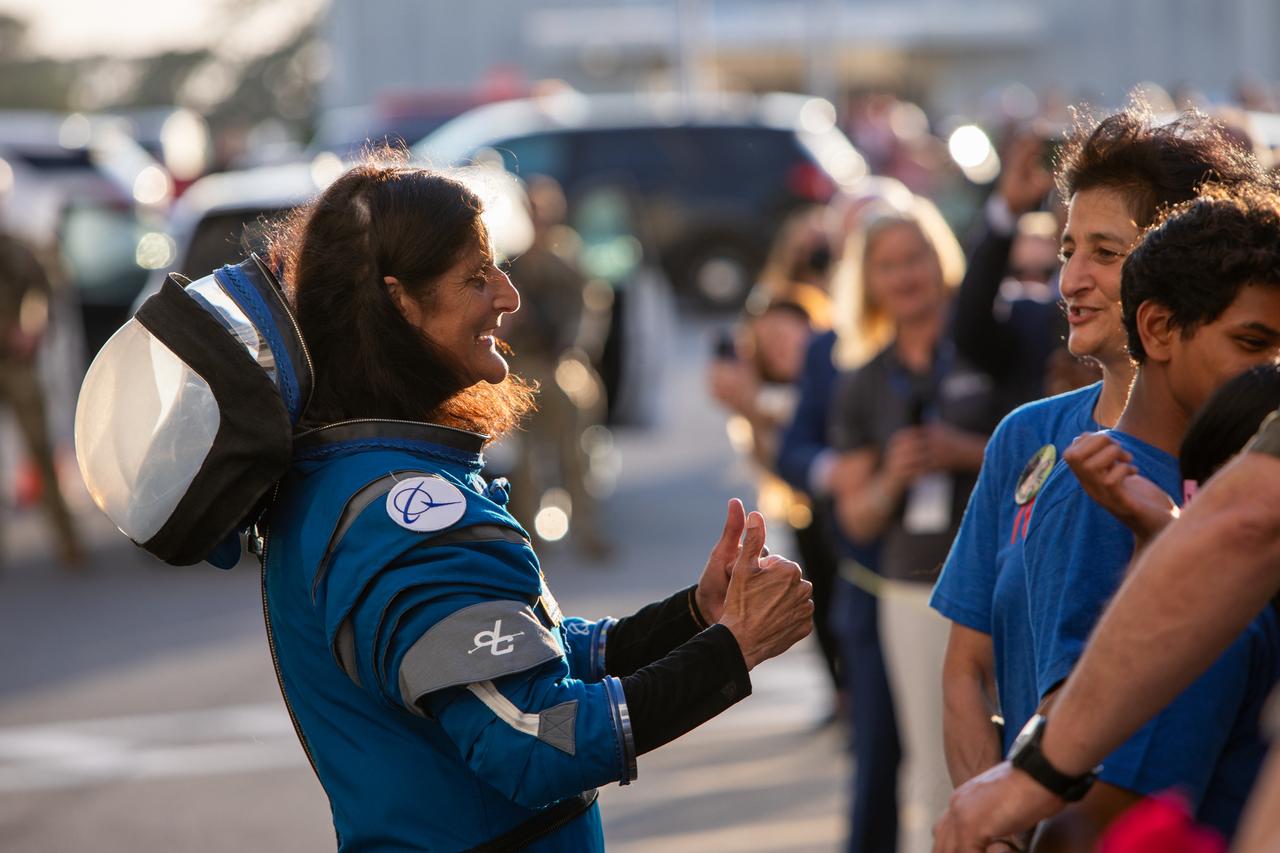During the first launch attempt of NASA’s Boeing Crew Flight Test, NASA astronaut Suni Williams says goodbye to friends and family upon exiting the Neil A. Armstrong Operations and Checkout Building at NASA’s Kennedy Space Center in Florida on Monday, May 6, 2024. As part of the agency’s Commercial Crew Program, the first crewed launch to the International Space Station aboard Boeing’s Starliner spacecraft atop a United Launch Alliance Atlas V rocket from Space Launch Complex-41 at nearby Cape Canaveral Space Force Station was targeted for 10:34 p.m. ET but scrubbed for the day.