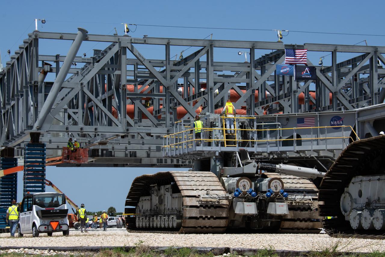 On Thursday, May 9, 2024, teams with NASA’s Exploration Ground Systems Program and primary contractor, Bechtel National, Inc., continue moving the base structure of mobile launcher 2 to a permanent mount structure where assembly will be completed at Kennedy Space Center in Florida. The 355-foot-tall mobile launcher 2 with a two-story base and a tower will be used to assemble and process the SLS (Space Launch System) rocket and Orion spacecraft in the Vehicle Assembly Building on NASA’s upcoming Artemis missions to the Moon beginning with Artemis IV.