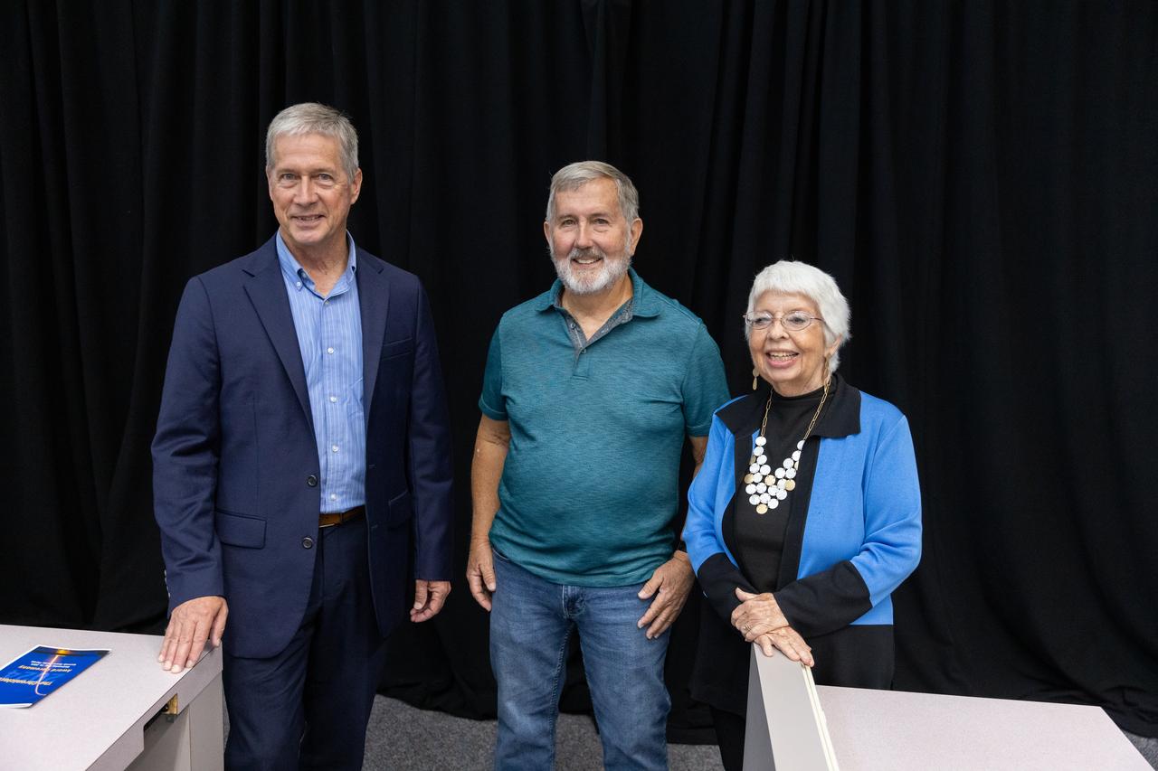 Dan Billow, Mike Brown, and Maggie Persinger were honored May 15, 2024, during the 2024 Kennedy Chroniclers ceremony at the Press Site at NASA’s Kennedy Space Center in Florida. Three brass plates bearing their names were added to the wall of the “bull pen,” where reporters traditionally gather to cover launches and events at NASA Kennedy. The three were honored for their efforts in helping tell the story of America’s space program, primarily from the Florida spaceport. They were nominated by their peers and selected by a panel of NASA officials and current space reporters.