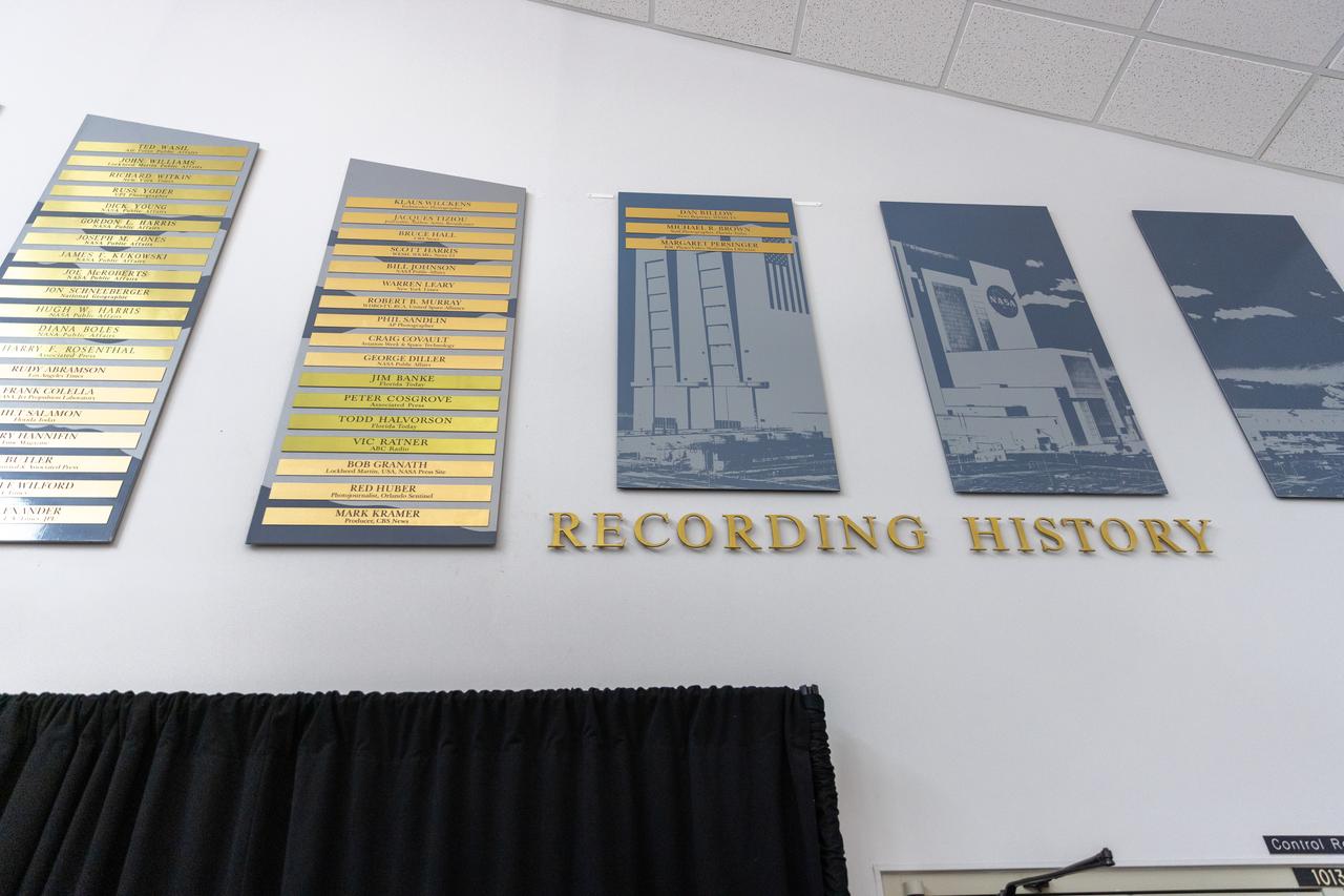 Dan Billow, Mike Brown, and Maggie Persinger were honored May 15, 2024, during the 2024 Kennedy Chroniclers ceremony at the Press Site at NASA’s Kennedy Space Center in Florida. Three brass plates bearing their names were added to the wall of the “bull pen,” where reporters traditionally gather to cover launches and events at NASA Kennedy. The three were honored for their efforts in helping tell the story of America’s space program, primarily from the Florida spaceport. They were nominated by their peers and selected by a panel of NASA officials and current space reporters.