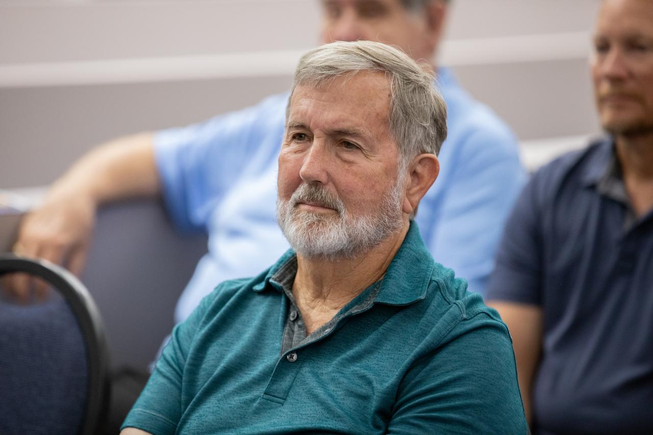 Mike Brown accepts a certificate naming him a Kennedy Chronicler during a May 15 ceremony at the Press Site at NASA’s Kennedy Space Center in Florida. Brown, a long-time space photographer, was among three reporters and industry professionals who were nominated by their peers and selected by a panel of NASA officials and current space reporters for their efforts in helping tell the story of America’s space program. Brass plates bearing their names were added to the wall of the “bull pen,” where reporters traditionally gather to cover launches and events at NASA Kennedy.