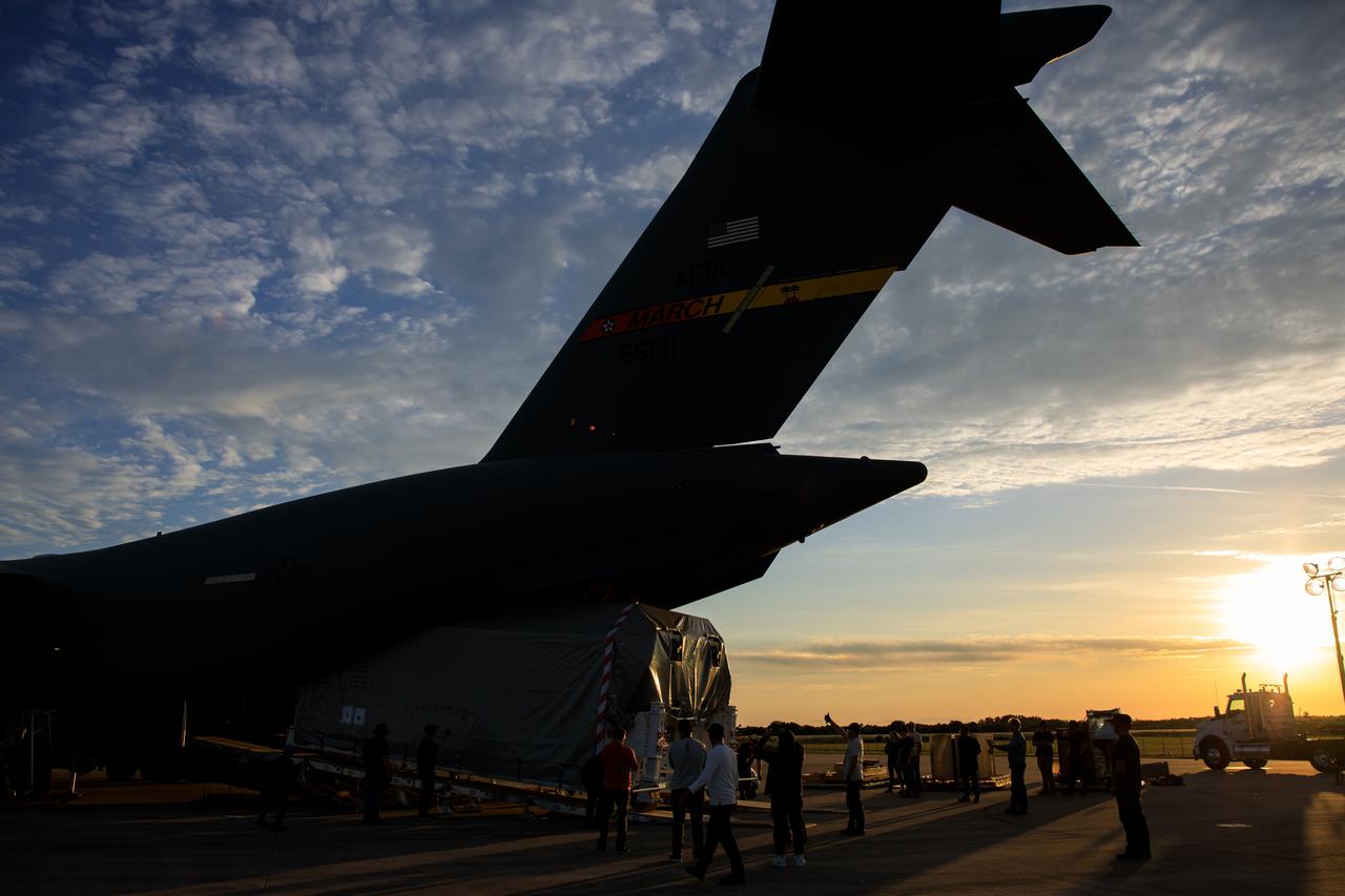 Teams offload NASA’s largest planetary mission spacecraft, Europa Clipper, from a United States Air Force C-17 Globemaster III transport aircraft onto the flatbed of a heavy-lift truck at the Launch and Landing Facility at NASA’s Kennedy Space Center in Florida on Thursday, May 23, 2024. Crews transported Europa Clipper to the Payload Hazardous Servicing Facility at Kennedy to prepare it for launch aboard a SpaceX Falcon Heavy rocket later this year from Launch Complex 39A at the Florida spaceport. Europa Clipper will help determine if conditions exist below the surface Jupiter’s fourth largest moon, Europa, that could support life.