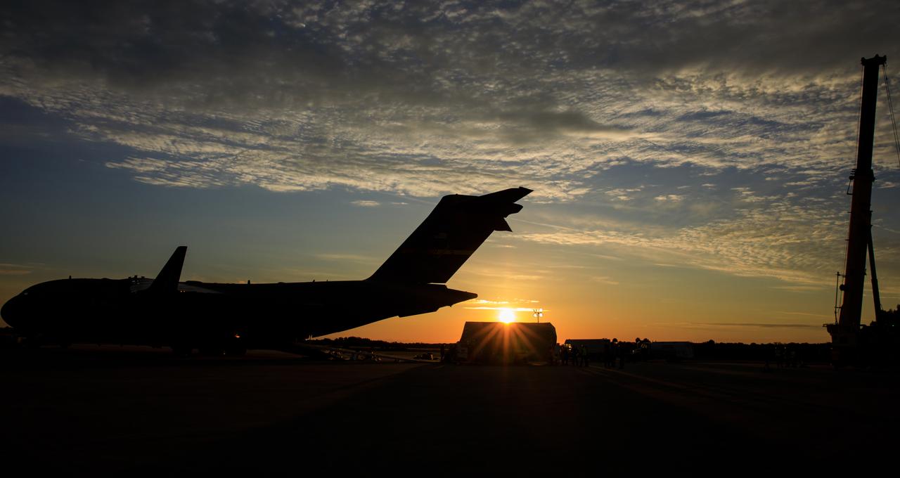 Teams offload NASA’s largest planetary mission spacecraft, Europa Clipper, from a United States Air Force C-17 Globemaster III transport aircraft onto the flatbed of a heavy-lift truck at the Launch and Landing Facility at NASA’s Kennedy Space Center in Florida on Thursday, May 23, 2024. Crews transported Europa Clipper to the Payload Hazardous Servicing Facility at Kennedy to prepare it for launch aboard a SpaceX Falcon Heavy rocket later this year from Launch Complex 39A at the Florida spaceport. Europa Clipper will help determine if conditions exist below the surface Jupiter’s fourth largest moon, Europa, that could support life.