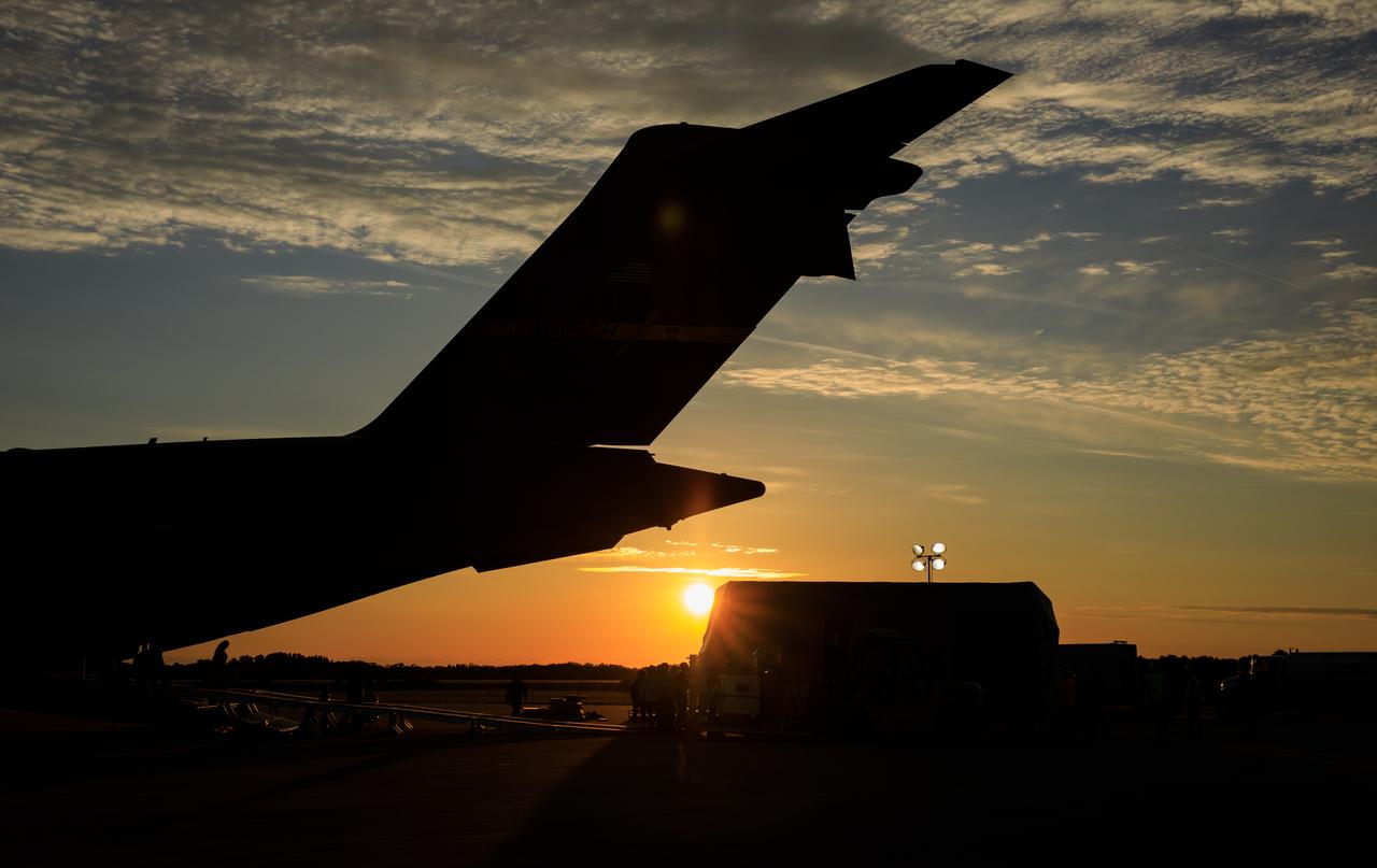 Teams offload NASA’s largest planetary mission spacecraft, Europa Clipper, from a United States Air Force C-17 Globemaster III transport aircraft onto the flatbed of a heavy-lift truck at the Launch and Landing Facility at NASA’s Kennedy Space Center in Florida on Thursday, May 23, 2024. Crews transported Europa Clipper to the Payload Hazardous Servicing Facility at Kennedy to prepare it for launch aboard a SpaceX Falcon Heavy rocket later this year from Launch Complex 39A at the Florida spaceport. Europa Clipper will help determine if conditions exist below the surface Jupiter’s fourth largest moon, Europa, that could support life.