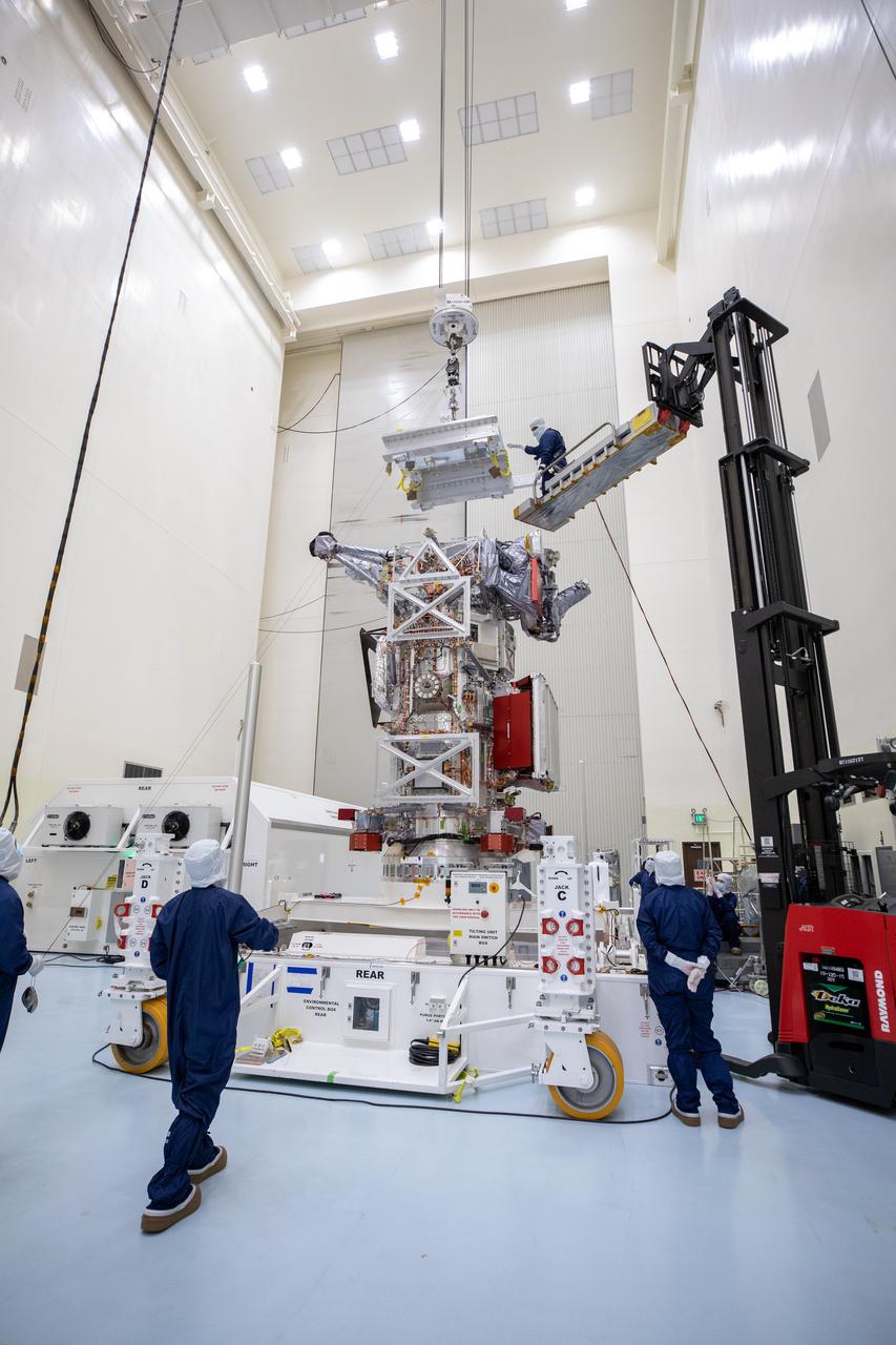Technicians inside the Payload Hazardous Servicing Facility at NASA’s Kennedy Space Center in Florida prepare to rotate the agency’s largest planetary mission spacecraft, Europa Clipper, to a vertical position on Tuesday, May 28, 2024, as part of prelaunch processing. Slated to launch aboard a SpaceX Falcon Heavy rocket later this year from Launch Complex 39A at Kennedy, Europa Clipper will help determine if conditions exist below the surface Jupiter’s fourth largest moon, Europa, that could support life.
