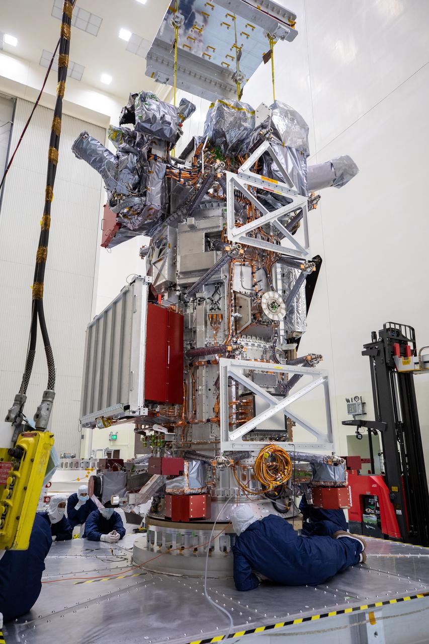 Technicians and engineers inside the Payload Hazardous Servicing Facility at NASA’s Kennedy Space Center in Florida inspect the agency’s largest planetary mission spacecraft, Europa Clipper, as part of prelaunch processing on Tuesday, May 28, 2024. Slated to launch aboard a SpaceX Falcon Heavy rocket later this year from Launch Complex 39A at Kennedy, Europa Clipper will help determine if conditions exist below the surface Jupiter’s fourth largest moon, Europa that could support life.