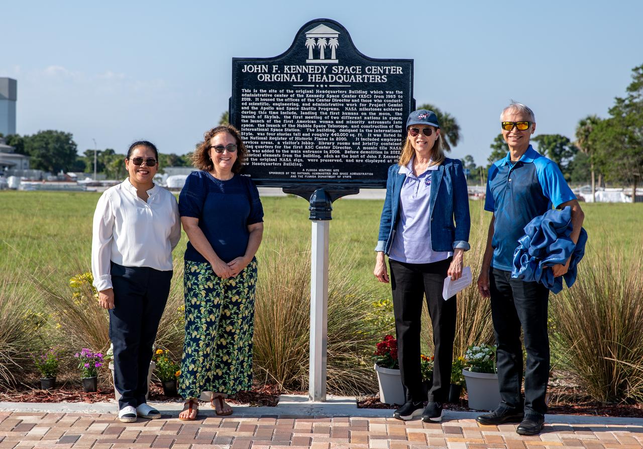 From the left, NASA Kennedy Space Center’s, Maui Dalton, project manager, engineering; Katherine Zeringue, cultural resources manager; Janet Petro, NASA Kennedy Space Center director; and Ismael Otero, project manager, engineering, present a large bronze historical marker plaque at the location of NASA Kennedy’s original headquarters building on Tuesday, May 28, 2024. Approved in April 2023 as part of the State of Florida’s Historical Markers program in celebration of National Historic Preservation Month, the marker commemorates the early days of space exploration and is displayed permanently just west of the seven-story, 200,000 square foot Central Campus Headquarters Building, which replaced the old building in 2019.   