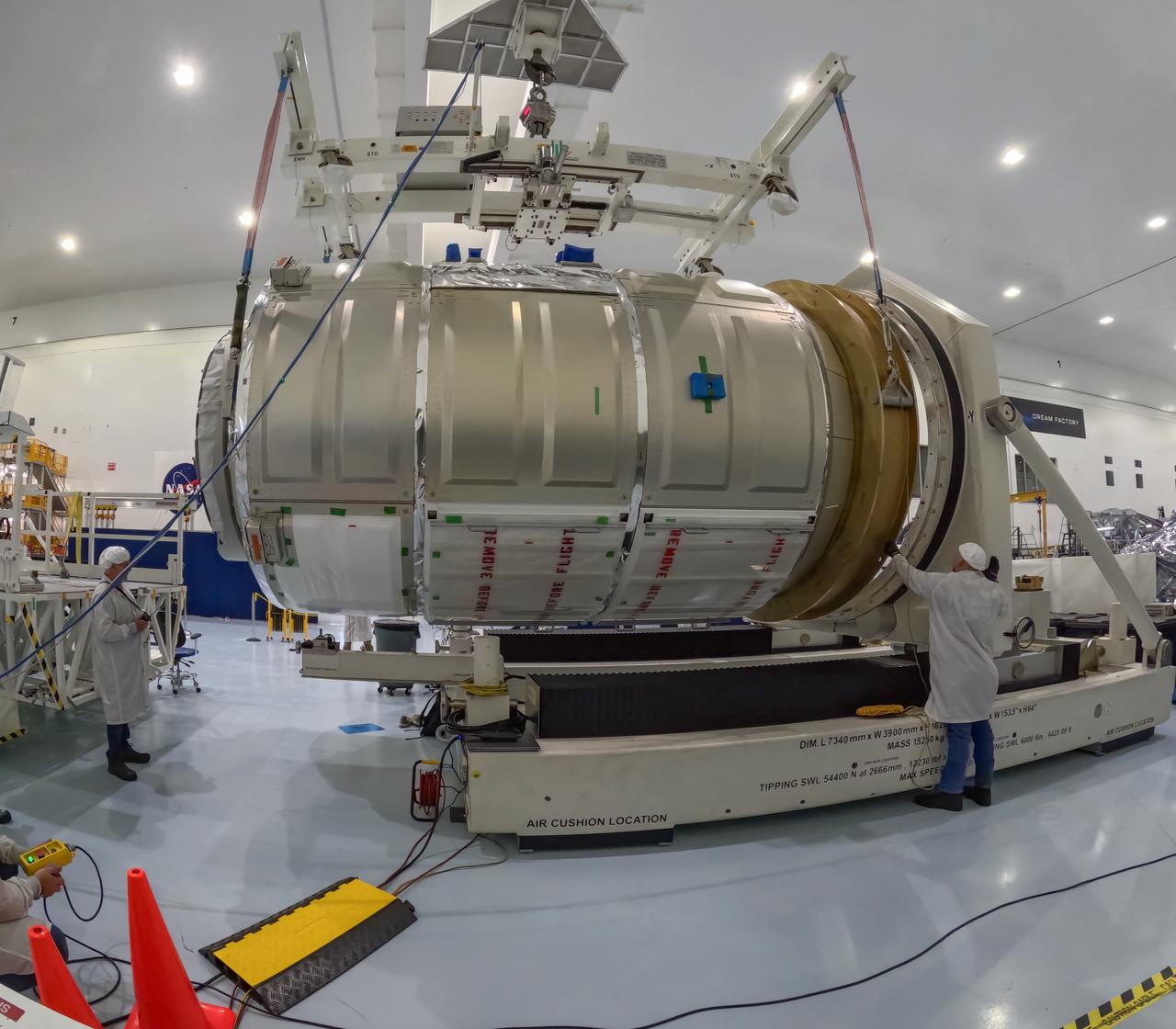 The Northrop Grumman Cygnus spacecraft’s pressurized cargo module for the company’s 21st commercial resupply mission is lifted and moved by a crane inside the Space Systems Processing Facility at NASA’s Kennedy Space Center in Florida on Saturday, June 1, 2024, as prelaunch processing operations continue. The Cygnus spacecraft will launch to the International Space Station aboard a SpaceX Falcon 9 rocket from Space Launch Complex 40 at Cape Canaveral Space Force Station.