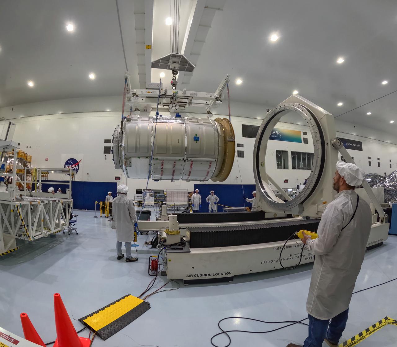 The Northrop Grumman Cygnus spacecraft’s pressurized cargo module for the company’s 21st commercial resupply mission is lifted and moved by a crane inside the Space Systems Processing Facility at NASA’s Kennedy Space Center in Florida on Saturday, June 1, 2024, as prelaunch processing operations continue. The Cygnus spacecraft will launch to the International Space Station aboard a SpaceX Falcon 9 rocket from Space Launch Complex 40 at Cape Canaveral Space Force Station.