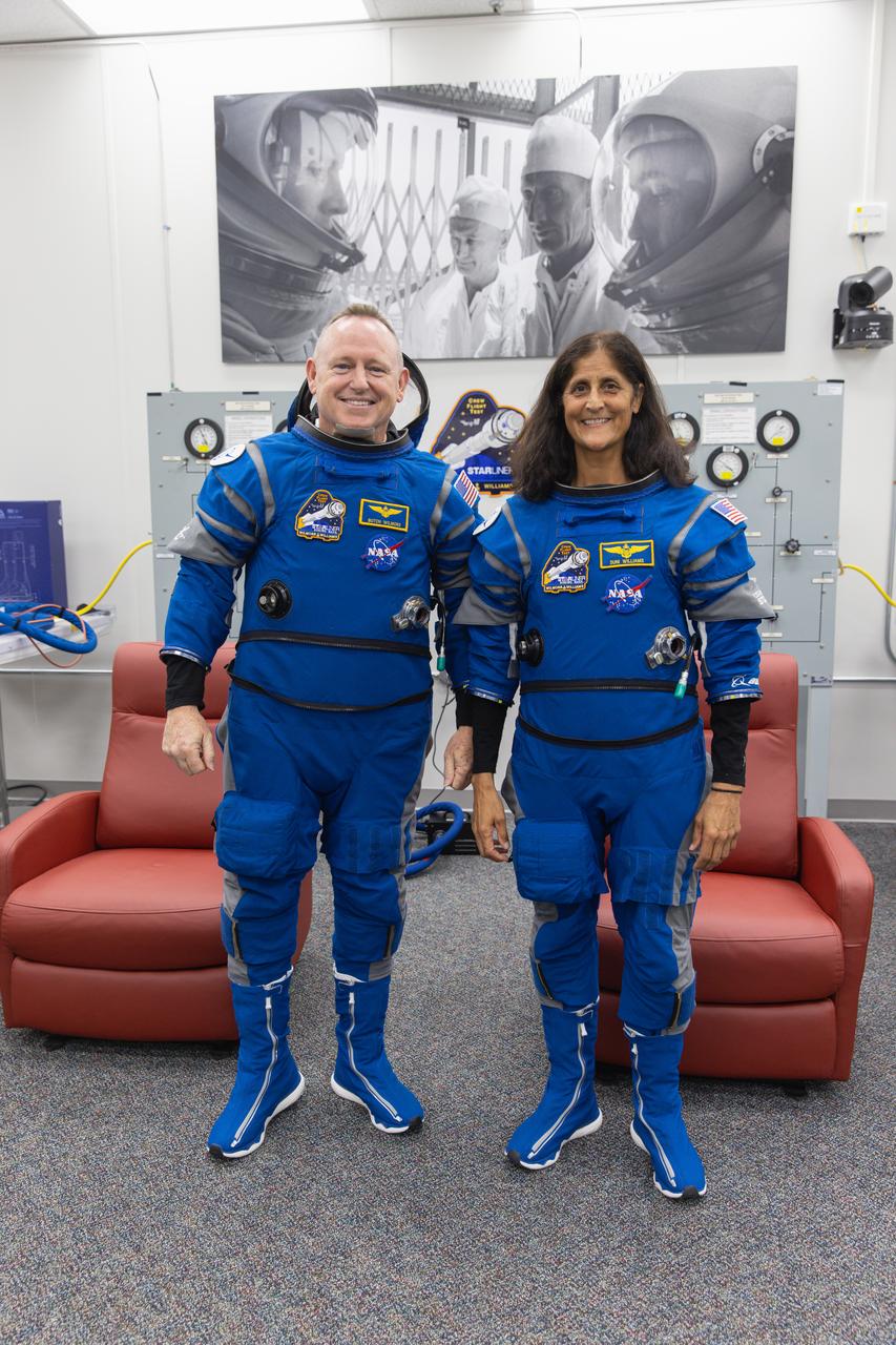 NASA’s Boeing Crew Flight Test astronauts Butch Wilmore and Suni Williams pose for photos inside the crew suit-up room inside the Neil A. Armstrong Operations and Checkout Building at NASA’s Kennedy Space Center in Florida on Wednesday, June 5, 2024. As part of the agency’s Commercial Crew Program, Wilmore and Williams are preparing for the first crewed launch to the International Space Station aboard Boeing’s Starliner spacecraft atop a United Launch Alliance Atlas V rocket from Space Launch Complex-41 at nearby Cape Canaveral Space Force Station at 10:52 a.m. EDT.