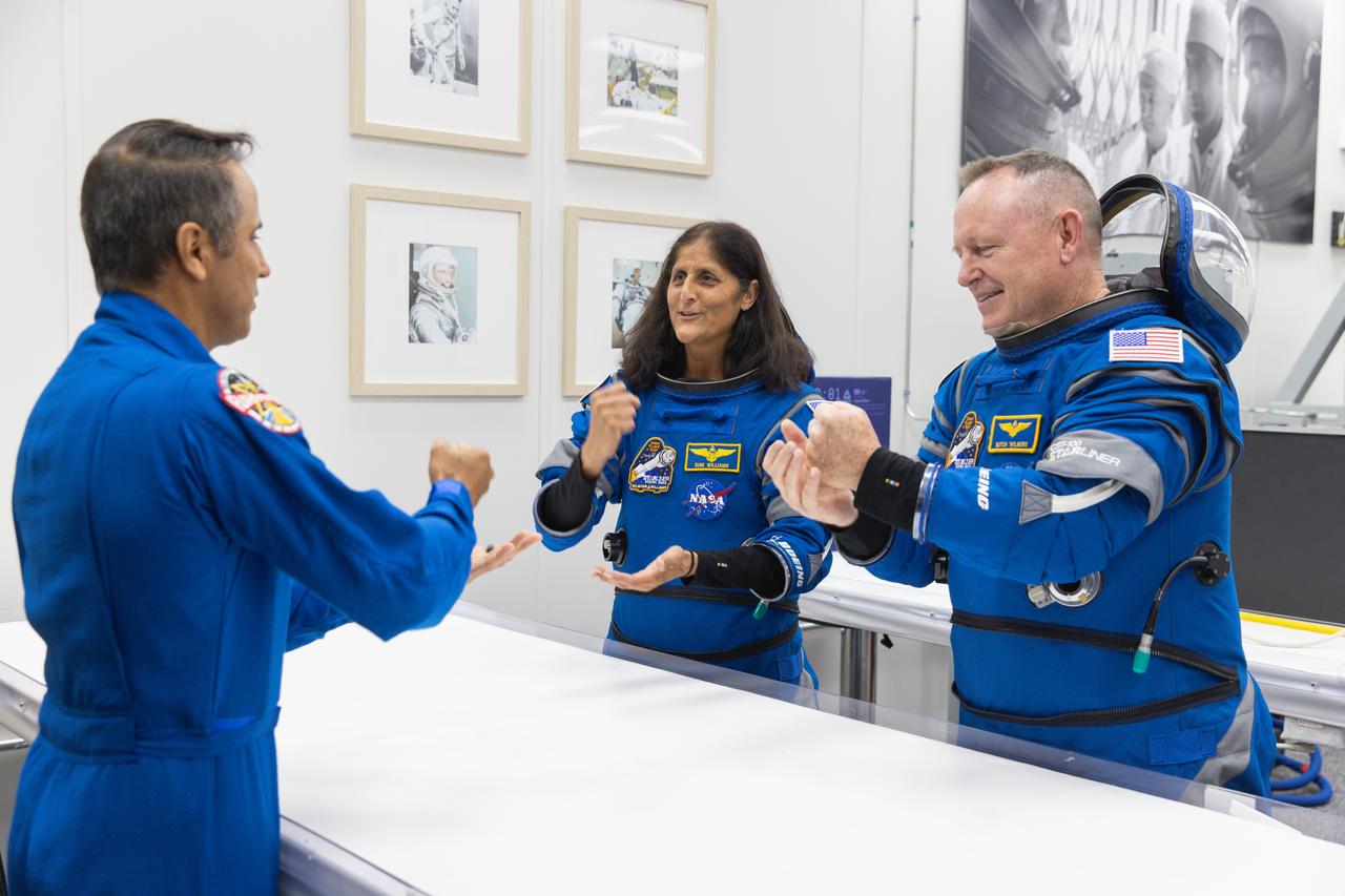 After suit-up and final fit checks, NASA’s Boeing Crew Flight Test astronauts Butch Wilmore and Suni Williams participate in a traditional game of rock, paper, scissors inside the Neil A. Armstrong Operations and Checkout Building at NASA’s Kennedy Space Center in Florida on Wednesday, June 5, 2024. The crew members are preparing for launch to the International Space Station aboard Boeing’s Starliner spacecraft atop a United Launch Alliance Atlas V rocket from Space Launch Complex-41 at nearby Cape Canaveral Space Force Station at 10:52 a.m. EDT.