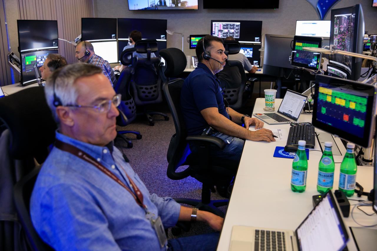 From left, James Wood, chief engineer and Akash Vangani, deputy chief engineer with the Launch Services Program at NASA’s Kennedy Space Center, participate in a mission dress rehearsal on Monday, June 17, 2024, inside Hangar AE at Cape Canaveral Space Force Station in Florida for the National Oceanic and Atmospheric Administration (NOAA) GOES-U (Geostationary Operational Environmental Satellite U) mission. The GOES-U satellite, the final addition to GOES-R series, will serve a critical role in providing continuous coverage of the Western Hemisphere, including monitoring tropical systems in the eastern Pacific and Atlantic oceans launched Tuesday, June 25, 2024.