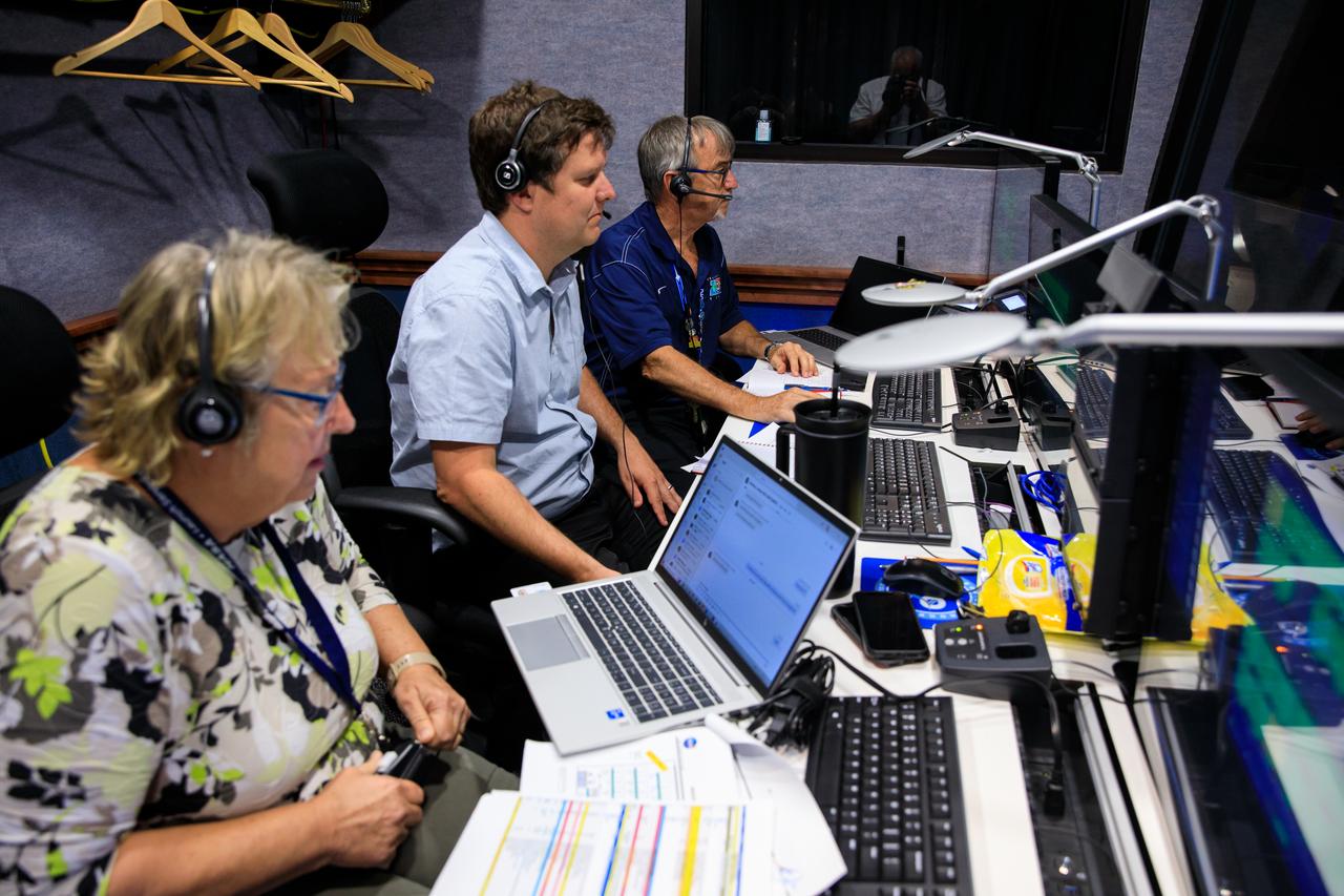 From right, Brian Lawson, Lead System Engineer at a.i. solutions; Reed Divertie, chief of Communications and Telemetry in the Ground System Integration Branch with the Launch Services Program at NASA’s Kennedy Space Center; and Lois Clutter, Mission Communications Engineer, Flight Operations Engineer with the Launch Services Program at NASA Kennedy participate in a mission dress rehearsal on Monday, June 17, 2024, inside Hangar AE at Cape Canaveral Space Force Station in Florida for the National Oceanic and Atmospheric Administration (NOAA) GOES-U (Geostationary Operational Environmental Satellite U) mission. The GOES-U satellite, the final addition to GOES-R series, will serve a critical role in providing continuous coverage of the Western Hemisphere, including monitoring tropical systems in the eastern Pacific and Atlantic oceans launched Tuesday, June 25, 2024.