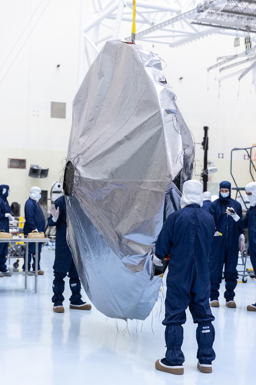 Technicians prepare to install the nearly 10 feet (3 meters) wide dish-shaped high-gain antenna to NASA’s Europa Clipper, a spacecraft to study Jupiter’s icy moon, at the agency’s Payload Hazardous Servicing Facility at Kennedy Space Center in Florida on Monday, June 17, 2024. The spacecraft will perform a series of flybys of the Jupiter moon Europa to gather data on its atmosphere, icy crust, and the ocean underneath, and the high-gain antenna will send the research data to scientists on Earth to determine if the moon can support habitable condition. The Europa Clipper spacecraft is scheduled to launch atop a SpaceX Falcon Heavy rocket from Kennedy’s Launch Complex 39A no earlier than October 2024. 