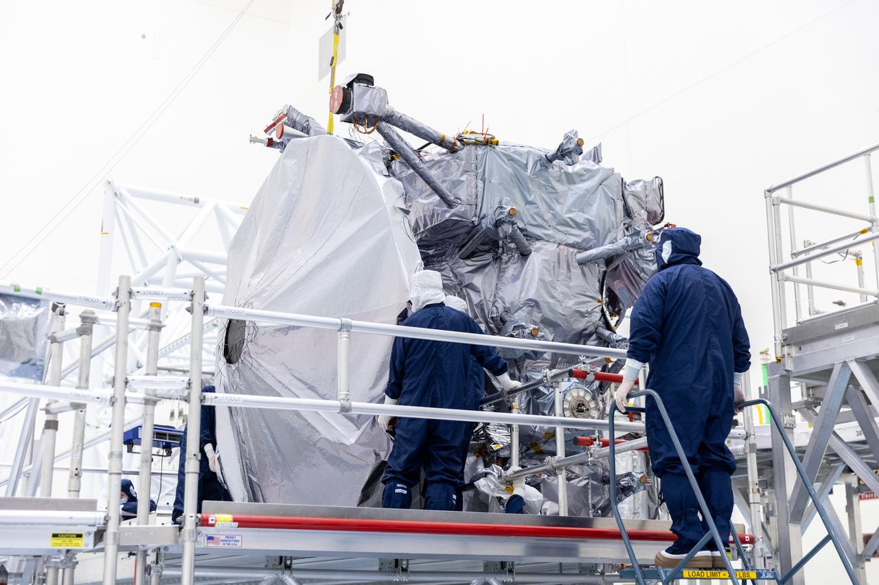 Technicians prepare to install the nearly 10 feet (3 meters) wide dish-shaped high-gain antenna to NASA’s Europa Clipper, a spacecraft to study Jupiter’s icy moon, at the agency’s Payload Hazardous Servicing Facility at Kennedy Space Center in Florida on Monday, June 17, 2024. The spacecraft will perform a series of flybys of the Jupiter moon Europa to gather data on its atmosphere, icy crust, and the ocean underneath, and the high-gain antenna will send the research data to scientists on Earth to determine if the moon can support habitable condition. The Europa Clipper spacecraft is scheduled to launch atop a SpaceX Falcon Heavy rocket from Kennedy’s Launch Complex 39A no earlier than October 2024. 