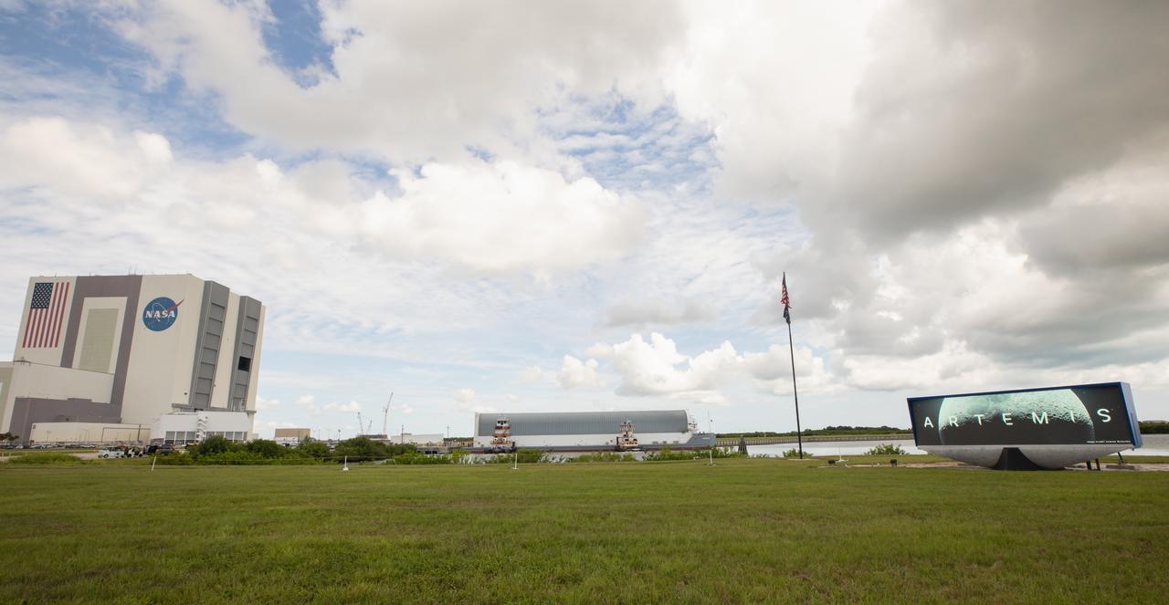 NASA’s Pegasus barge, carrying the agency’s massive SLS (Space Launch System) core stage, arrives at NASA’s Kennedy Space Center Complex 39 turn basin wharf in Florida on Tuesday, July 23, 2024, after journeying from the agency’s Michoud Assembly Facility in New Orleans. The core stage is the next piece of Artemis hardware to arrive at the spaceport and will be offloaded and moved to NASA Kennedy’s Vehicle Assembly Building, where it will be prepared for integration ahead of the Artemis II launch.