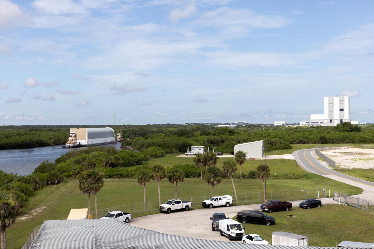 NASA’s Pegasus barge, carrying the agency’s massive SLS (Space Launch System) core stage, arrives at NASA’s Kennedy Space Center Complex 39 turn basin wharf in Florida on Tuesday, July 23, 2024, after journeying from the agency’s Michoud Assembly Facility in New Orleans. The core stage is the next piece of Artemis hardware to arrive at the spaceport and will be offloaded and moved to NASA Kennedy’s Vehicle Assembly Building, where it will be prepared for integration ahead of the Artemis II launch. 