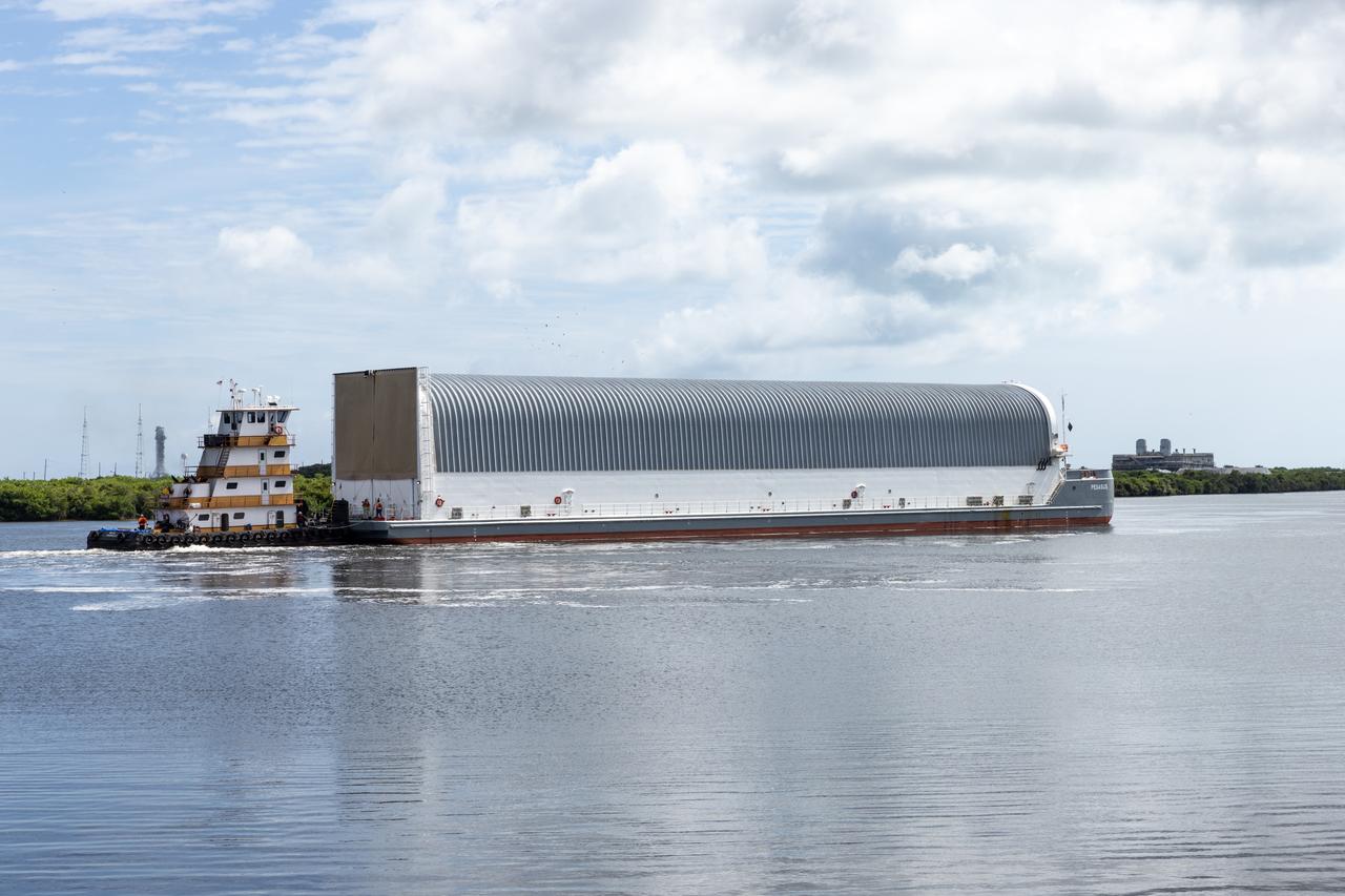NASA’s Pegasus barge, carrying the agency’s massive SLS (Space Launch System) core stage, arrives at NASA’s Kennedy Space Center Complex 39 turn basin wharf in Florida on Tuesday, July 23, 2024, after journeying from the agency’s Michoud Assembly Facility in New Orleans. The core stage is the next piece of Artemis hardware to arrive at the spaceport and will be offloaded and moved to NASA Kennedy’s Vehicle Assembly Building, where it will be prepared for integration ahead of the Artemis II launch. 