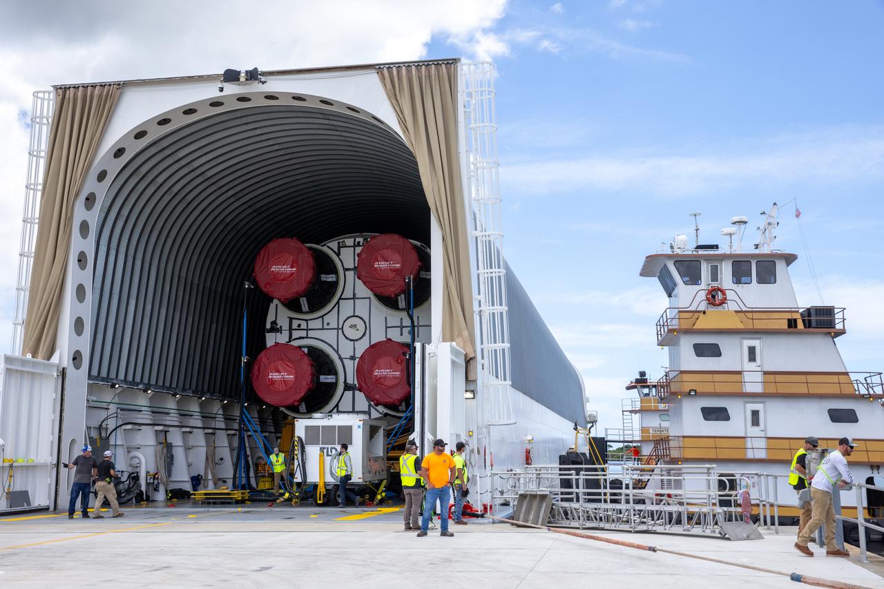 NASA’s Pegasus barge, carrying the agency’s massive SLS (Space Launch System) core stage, arrives at NASA’s Kennedy Space Center Complex 39 turn basin wharf in Florida on Tuesday, July 23, 2024, after journeying from the agency’s Michoud Assembly Facility in New Orleans. The core stage is the next piece of Artemis hardware to arrive at the spaceport and will be offloaded and moved to NASA Kennedy’s Vehicle Assembly Building, where it will be prepared for integration ahead of the Artemis II launch. 