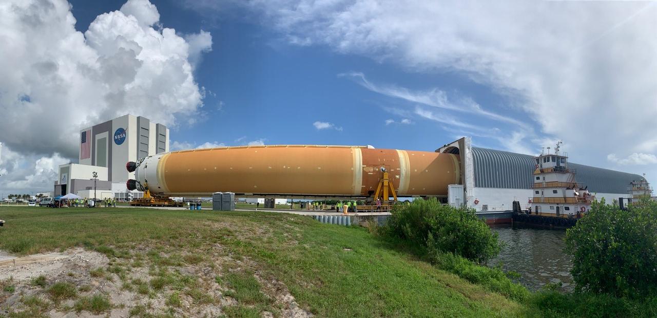 NASA’s massive 212-foot long SLS (Space Launch System) core stage is offloaded from the agency’s Pegasus Barge on Wednesday, July 24, 2024, after arriving at NASA’s Kennedy Space Center in Florida. Teams with Exploration Ground Systems (EGS) will transfer the rocket stage to the spaceport’s Vehicle Assembly Building to prepare it for integration atop the mobile launcher ahead of the Artemis II launch.