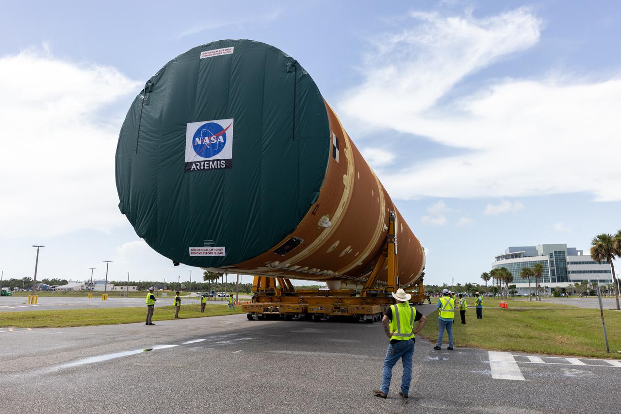 After completing its journey from NASA’s Michoud Assembly Facility in New Orleans aboard the Pegasus barge, teams with Exploration Ground Systems (EGS) transport the agency’s powerful SLS (Space Launch System) core stage to NASA’s Kennedy Space Center’s Vehicle Assembly Building in Florida on Wednesday, July 24, 2024. Once inside, SLS will be prepared for integration atop the mobile launcher ahead of the Artemis II launch.