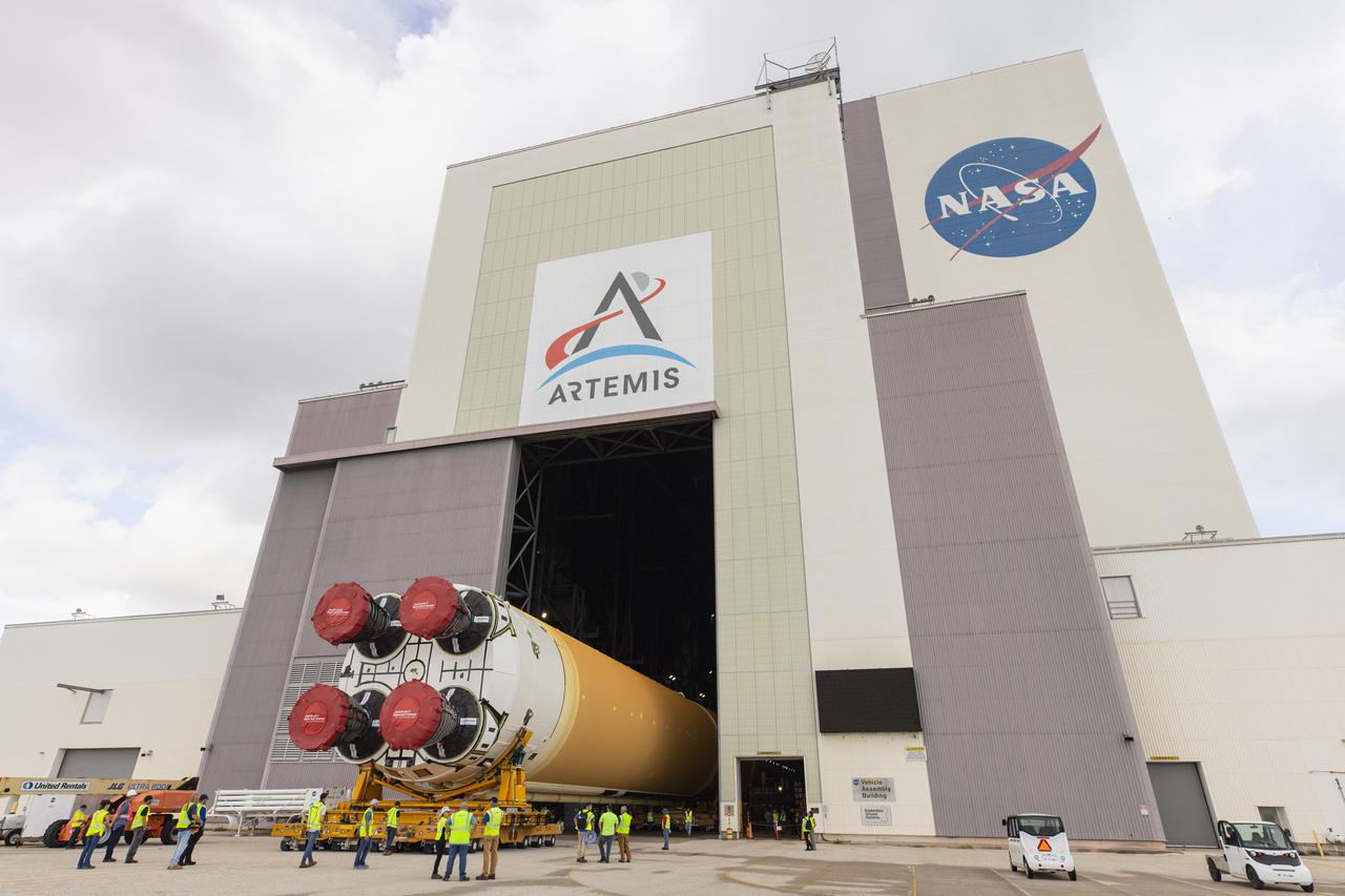After completing its journey from NASA’s Michoud Assembly Facility in New Orleans aboard the Pegasus barge, teams with Exploration Ground Systems (EGS) transport the agency’s powerful SLS (Space Launch System) core stage into the transfer aisle inside Kennedy Space Center’s Vehicle Assembly Building in Florida on Wednesday, July 24, 2024. In the coming months, SLS will be prepared for integration atop the mobile launcher ahead of the Artemis II launch.